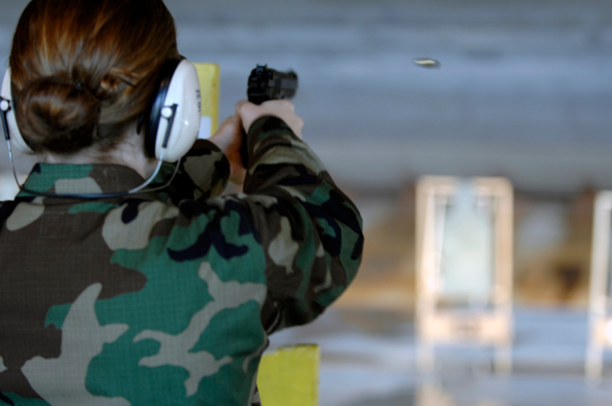 Air Force Reserve Officers' Training Corps Cadet Anna Sheppard fires an M9 at the Combat Arms Training and Maintenance facility here June 6. The course was designed to familiarize cadets with weapons. (U.S. Air Force photo/Airman Matthew Flynn)