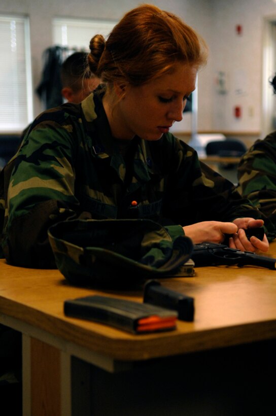 Air Force Reserve Officers' Training Corps Cadet Teri Weber assembles a weapon at the Combat Arms Training and Maintenance facility here June 6. The course was designed to familiarize cadets with weapons. (U.S. Air Force photo/Airman Matthew Flynn)
