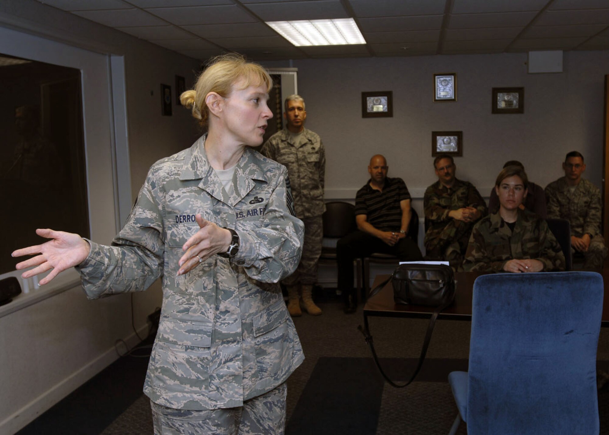 Chief Master Sergeant Pamela A. Derrow, Command Chief Master Sergeant of United States Air Forces in Europe, talks with Airmen from the 100th Communications Squadron at RAF Mildenhall, England, June 3. The former 100th Communications Squadron Information Systems Flight superintendent was the 100th Air Refueling Wing's interim Command Chief Master Sergeant here from Dec. 2002 to July 2003. During her visit to RAF Mildenhall, Chief Derrow also held an Airman's all call and visited the Air Force Smart Operations for the 21st Century Office. (U.S. Air Force photo by Master Sgt. Sarah Frankenhoff)