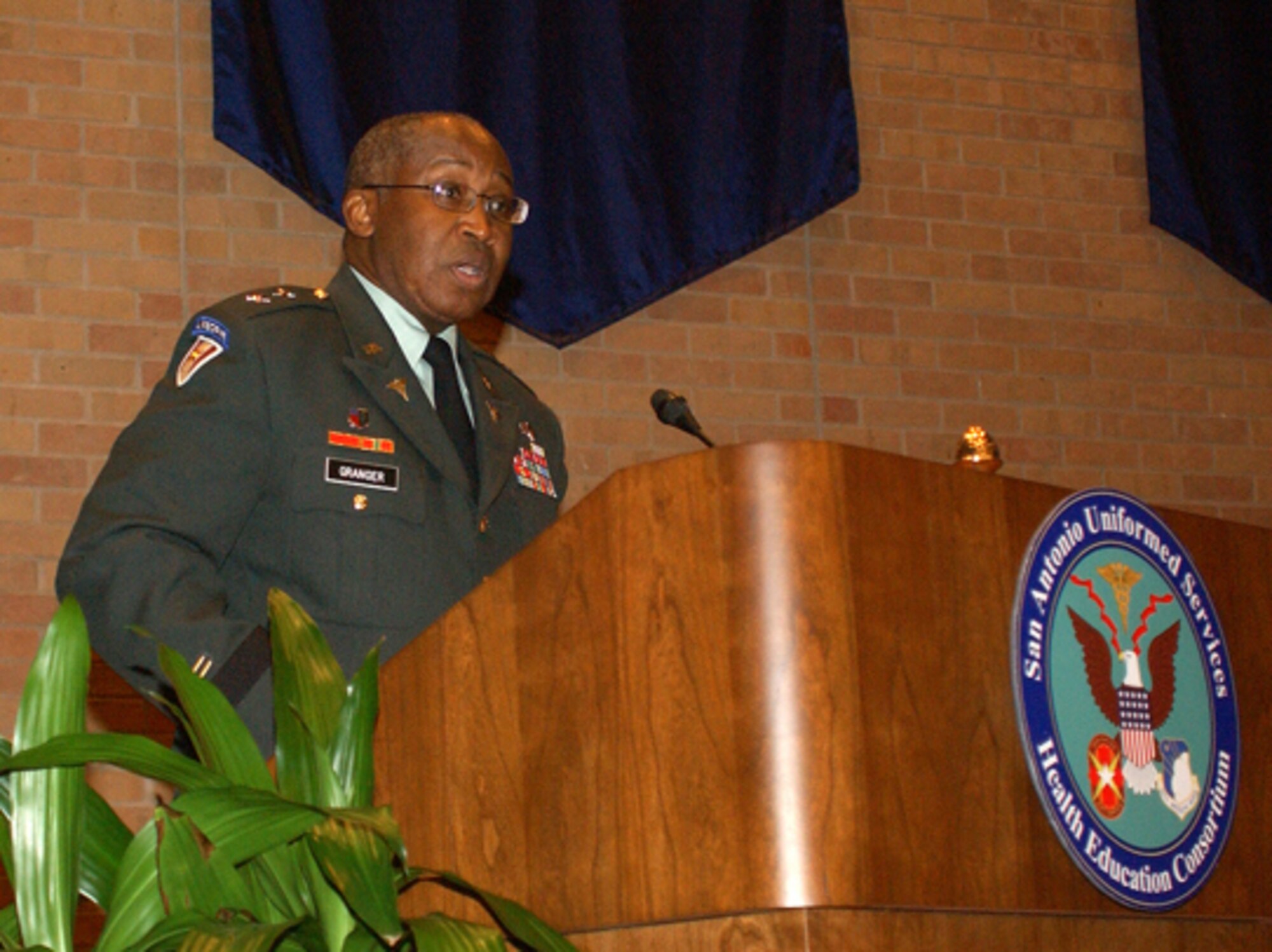 Army Maj. Gen. (Dr.) Elder Granger, deputy director and program executive officer of the TRICARE Management Activity, Office of the Assistant Secretary of Defense (Health Affairs), speaks at the San Antonio Uniformed Services Health Education Consortium awards and graduation ceremony June 6 in the University of Texas Health Science Center at San Antonio auditorium. (U.S. Air Force Photo/Alan Boedeker)