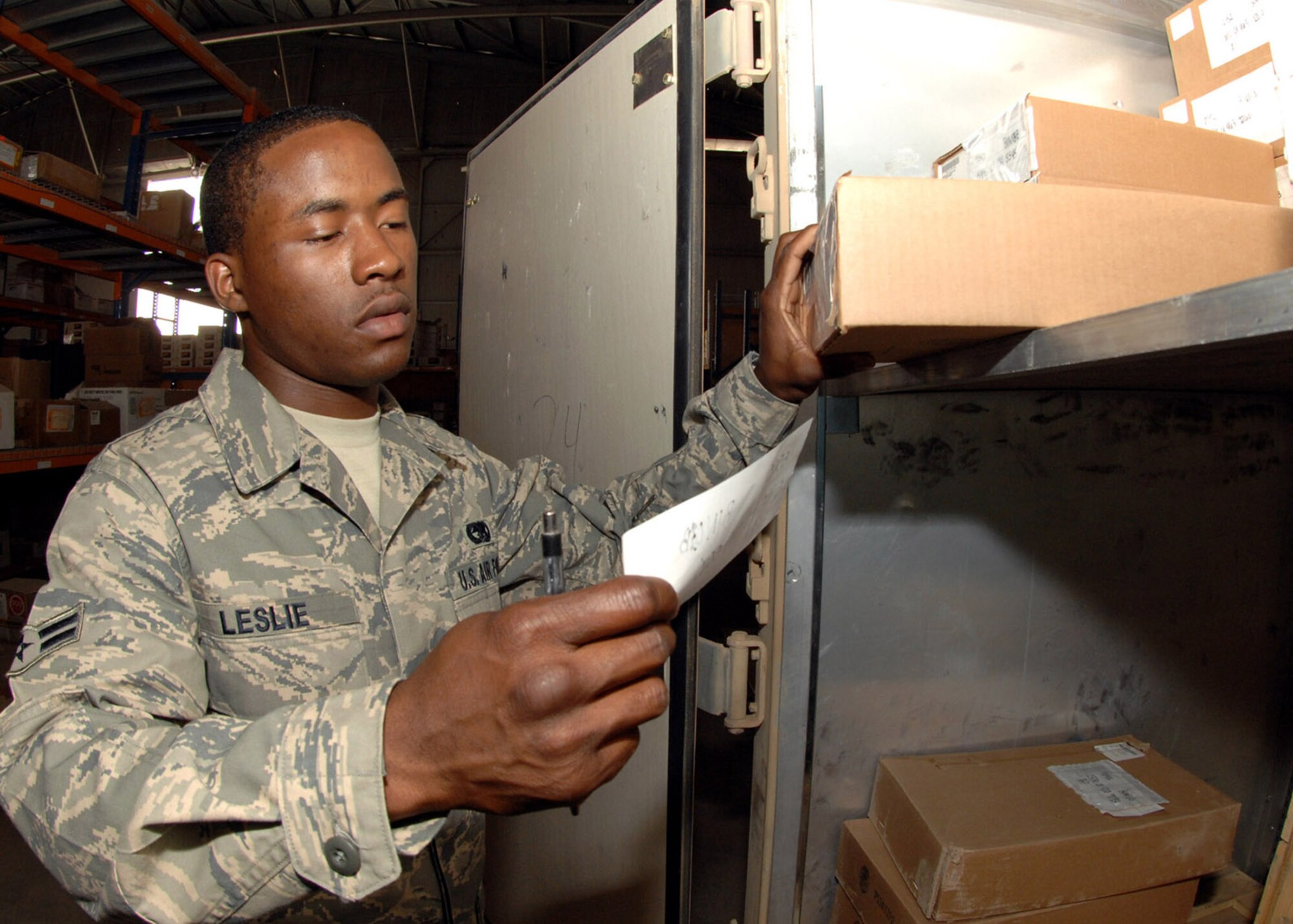 KIRKUK REGIONAL AIR BASE, Iraq - Airman 1st Class Alston Leslie, 506th Expeditionary Logistics Readiness Squadron supply technician, stores vehicle maintenance kit items recently here. Airman Leslie is deployed here from Grand Forks AFB, N.D., and is a native of West Palm Beach, Fla. (U.S. Air Force photo by Senior Airman SerMae Lampkin)