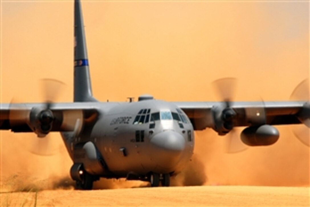 A C-130 Hercules aircraft assigned to the 145th Airlift Wing, North Carolina Air National Guard, performs a tactical landing on a dirt strip at the Sicily Landing Zone on Fort Bragg N.C., June 7, 2008, as a part of a D-Day re-enactment jump. 