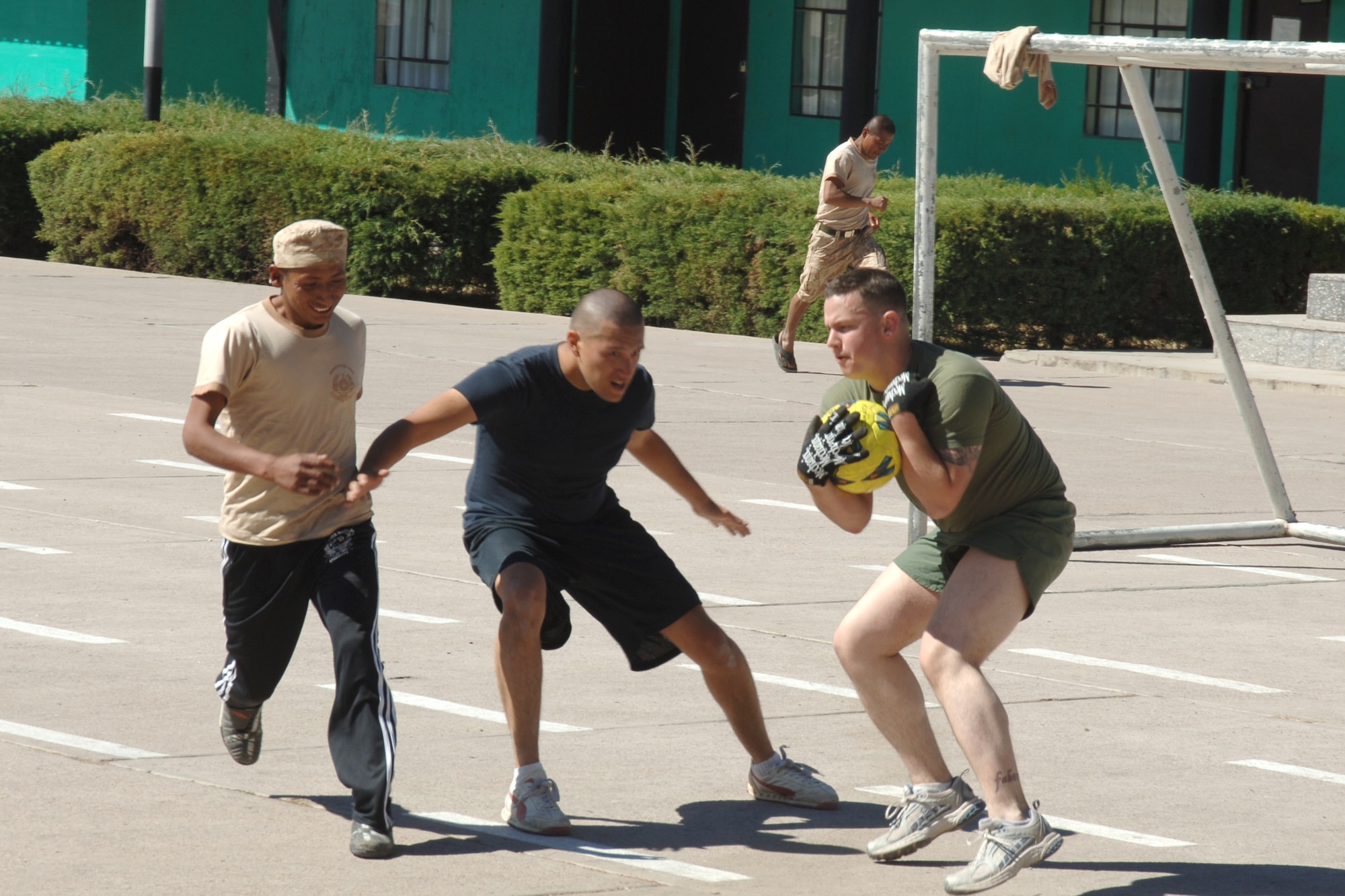 U.S. Airman George Monroe and U.S. Marine Travis Novack, assigned to Task Force New Horizons Peru, play defense in a soccer game, June 8, with Peruvian soldiers during New Horizons Peru 2008, a U.S. and Peruvian partnered humanitarian mission set on improving the quality of life for underprivileged Peruvians. (U.S. Air Force photo/Tech. Sgt. Kerry Jackson)