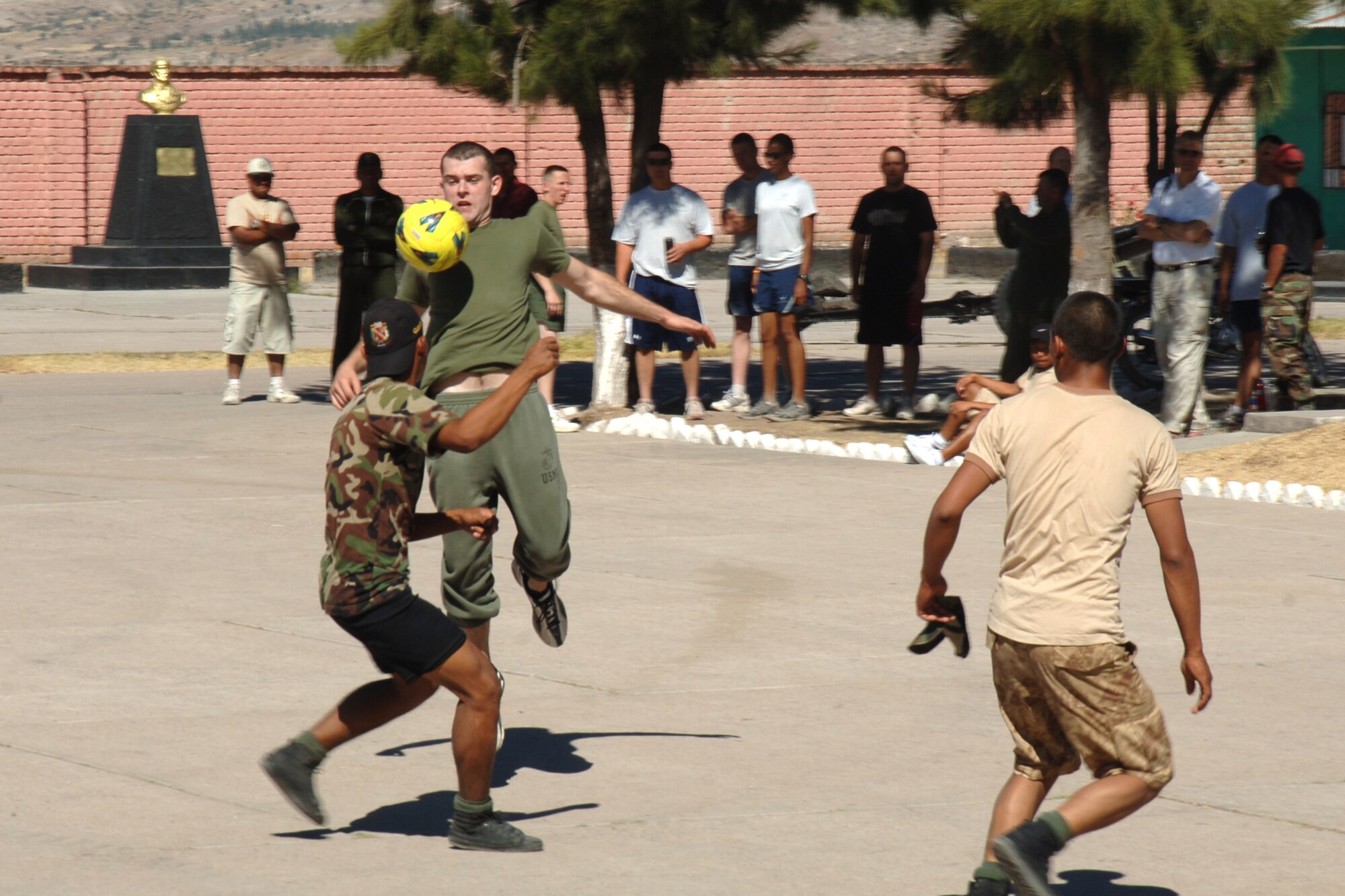 U.S. Marine Lance Cpl. Justin Kittz, assigned to Task Force New Horizons-Peru, traps a ball with his chest while playing a game of soccer, June 8 , with Peruvian soldiers during New Horizons Peru 2008, a humanitarian mission set on improving the quality of life for underprivileged Peruvian.  (photo by: U.S. Air Force Tech. Sgt. Kerry Jackson)