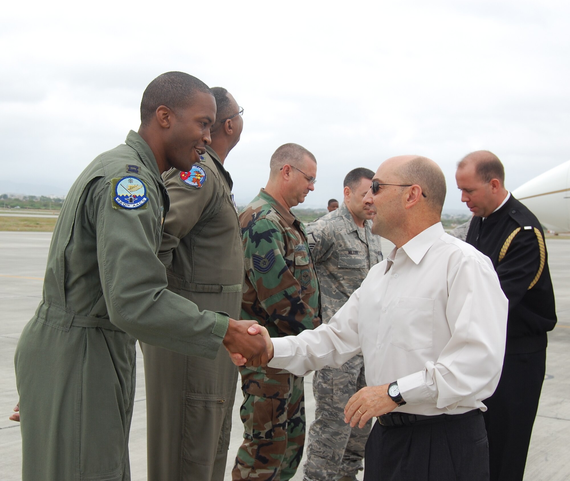 Admiral James Stavridis, U.S. Southern Command commander, greets Captain Lonzo Wallace, the Director of Operations for the 960th Airborne Warning and Control System detachment deployed to Forward Operating Location Manta, Ecuador.  Capt. Wallace was coined by the Admiral for being a top performer.  Admiral Stavridis spent several hours visiting with Airmen and getting a tour of the FOL on June 12.  (U.S. Air Force photo/Capt. Ashley Norris)