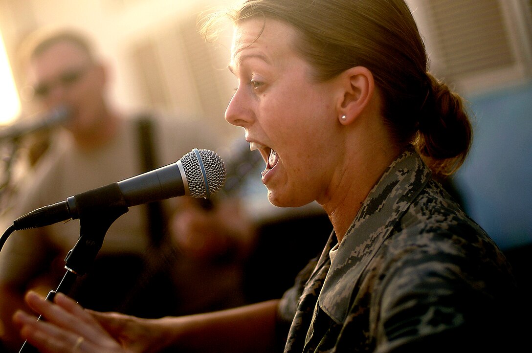 Staff Sgt. Krista Joyce performs for villagers May 22 in Negad, Djibouti. The band is deployed to support Combined Joint Task Force - Horn of Africa out of Camp Lemonier, Djibouti.  Sergeant Joyce is a vocalist with the U.S. Air Force Central Command band, Falcon.  (U.S. Air Force photo/Tech. Sgt. Jeremy T. Lock)