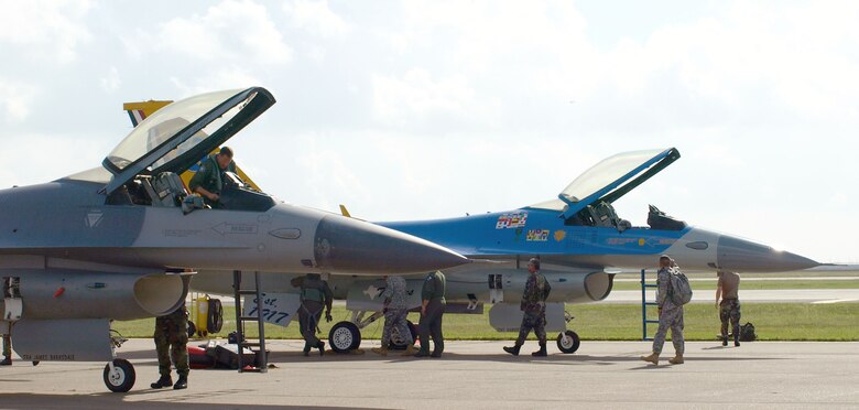 Two F-16 aircraft, one in the unit’s 75th anniversary color scheme, prepare for their final flight as part of the 147th Fighter Wing. (Texas Military Forces photo by Chief Master Sgt. Gonda Moncada)