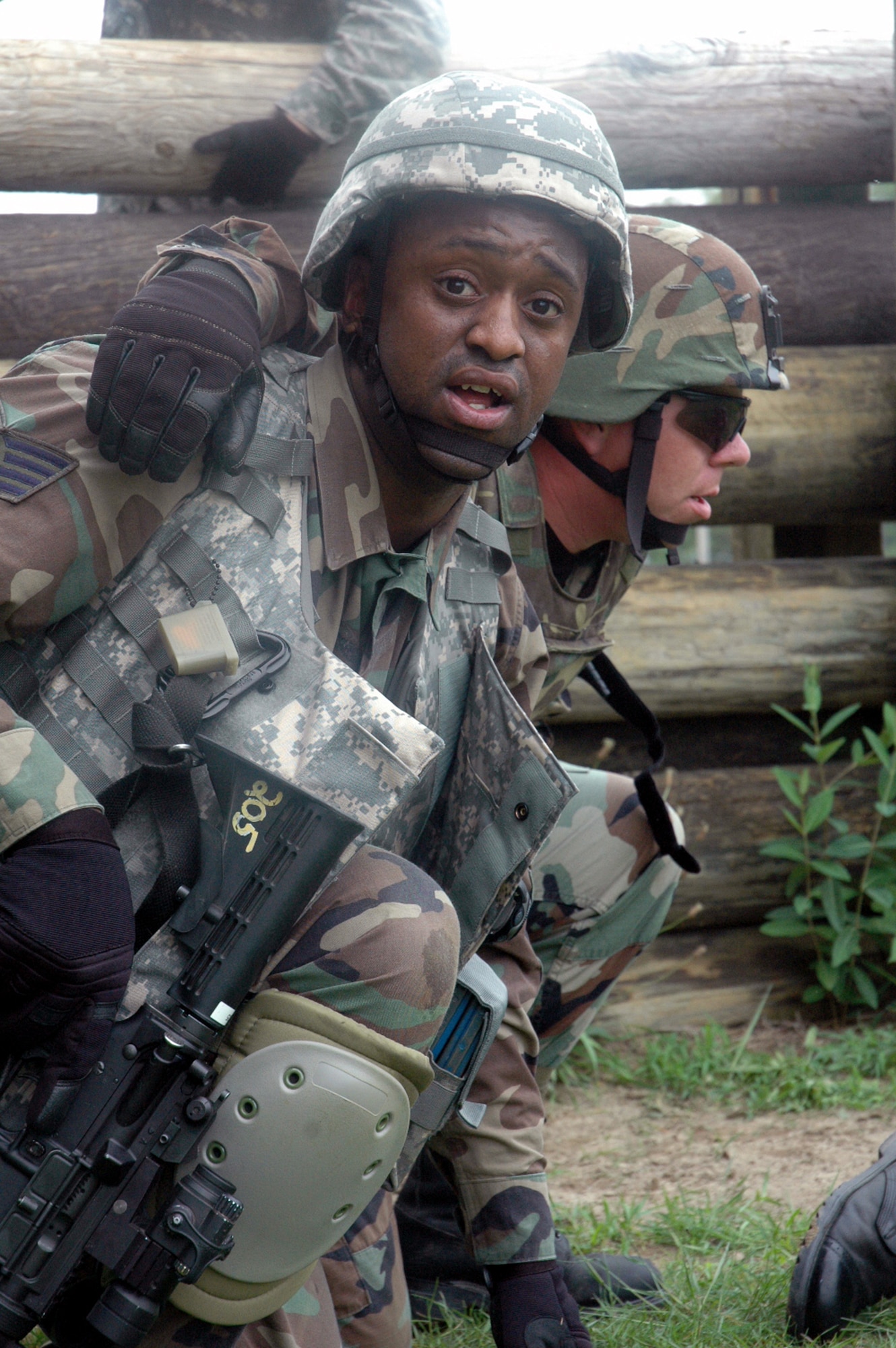 A student in the Air Force Phoenix Warrior Training Course 08-5 moves a "victim" during training in a combat first aid class on a Fort Dix, N.J., range June 5, 2008.  The course is taught by the U.S. Air Force Expeditionary Center's Expeditionary Operations School and 421st Combat Training Squadron and prepares security forces Airmen for upcoming deployments. Annually, the USAF EC trains more than 23,000 students in expeditionary- and mobility air force-based courses both with in-residence and distance learning.  (U.S. Air Force Photo/Tech. Sgt. Scott T. Sturkol)