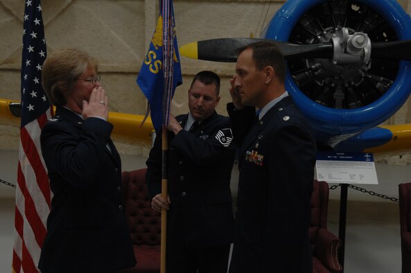 Col. Naomi Boss, 28th Medical Group commander exchanges salutes with Lt. Col. Jon Mohatt, 28th Medical Support Squadron commander, during a change of command ceremony at the South Dakota Air and Space Museum, June 10. The squadron’s mission is to provide wartime and peacetime readiness, logistical, facility, equipment, business operations, pharmaceutical services, laboratory and radiology as well as administrative services to support the medical care of all beneficiaries enrolled for health care at the 28 MDG. (U.S. Air Force photo/Airman 1st Class Adam Grant) 

