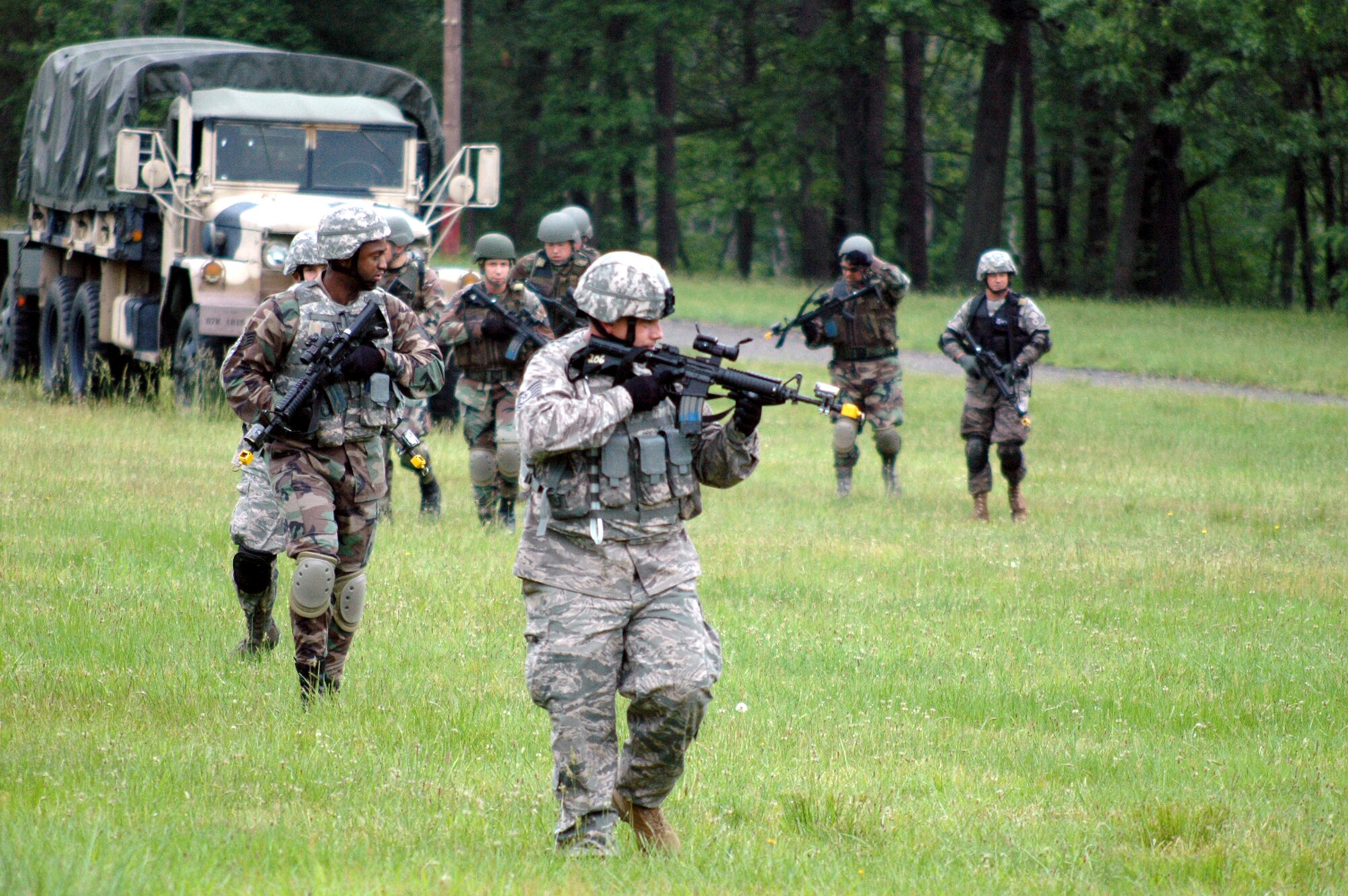 Students in the Air Force Phoenix Warrior Training Course 08-5 walk in a formation during a training in a combat first aid class on a Fort Dix, N.J., range June 5, 2008.  The course is taught by the U.S. Air Force Expeditionary Center's Expeditionary Operations School and 421st Combat Training Squadron and prepares security forces Airmen for upcoming deployments. Annually, the USAF EC trains more than 23,000 students in expeditionary- and mobility air force-based courses both with in-residence and distance learning.  (U.S. Air Force Photo/Tech. Sgt. Scott T. Sturkol)