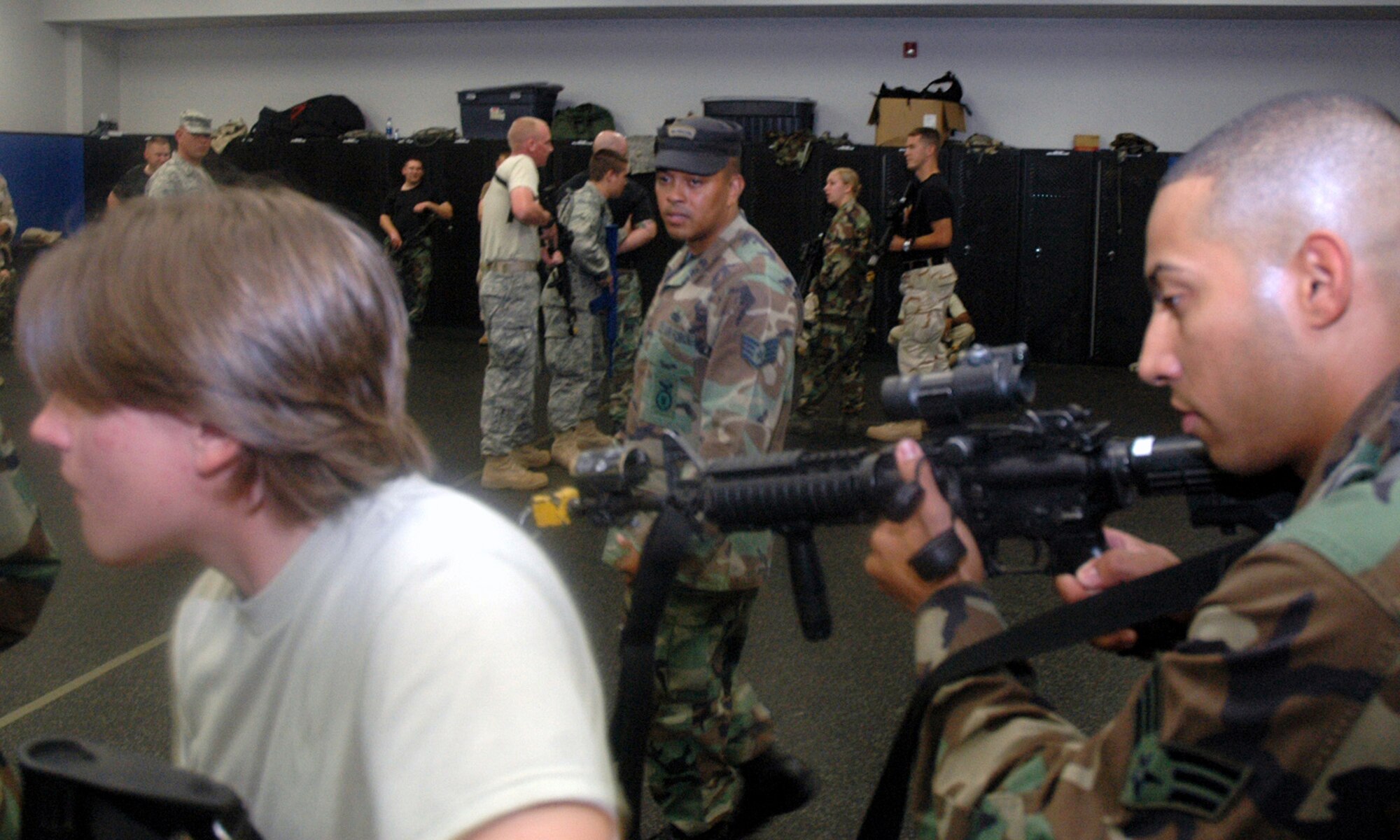Instructor Staff Sgt. Nelson Brown shows students in the Air Force Phoenix Warrior Training Course 08-5 proper technique for military operations in urban terrain during a "tape drills" class in the U.S. Air Force Expeditionary Center on Fort Dix, N.J., June 5, 2008.  The course is taught by the USAF EC's Expeditionary Operations School and 421st Combat Training Squadron and prepares security forces Airmen for upcoming deployments. Annually, the USAF EC trains more than 23,000 students in expeditionary- and mobility air force-based courses both with in-residence and distance learning.  (U.S. Air Force Photo/Tech. Sgt. Scott T. Sturkol)