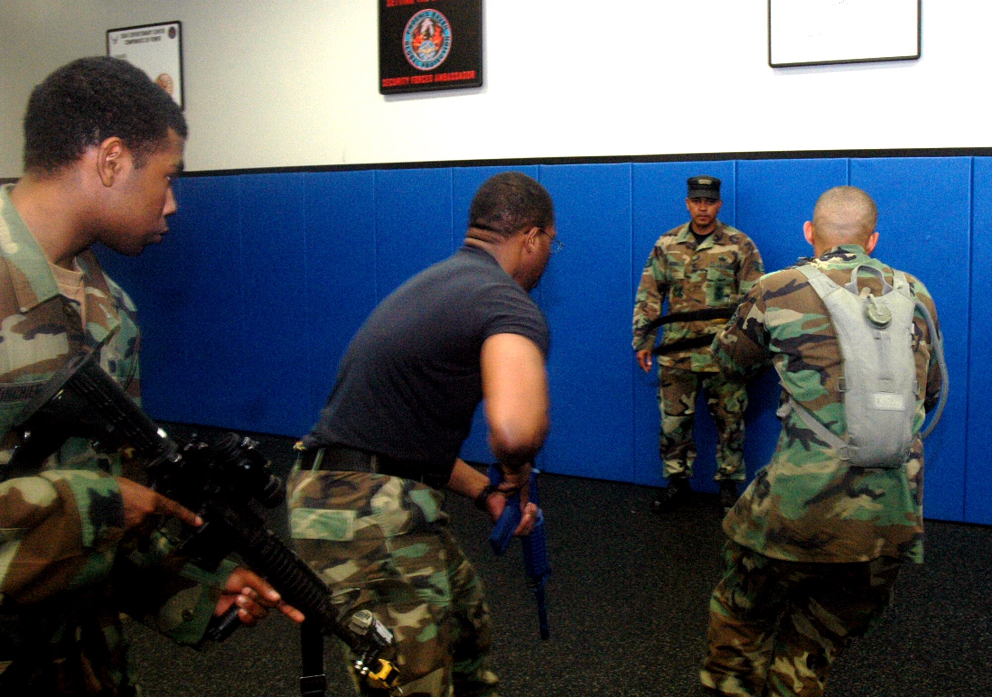 Students in the Air Force Phoenix Warrior Training Course 08-5 practice proper technique for military operations in urban terrain during a "tape drills" class in the U.S. Air Force Expeditionary Center on Fort Dix, N.J., June 5, 2008.  The course is taught by the USAF EC's Expeditionary Operations School and 421st Combat Training Squadron and prepares security forces Airmen for upcoming deployments. Annually, the USAF EC trains more than 23,000 students in expeditionary- and mobility air force-based courses both with in-residence and distance learning.  (U.S. Air Force Photo/Tech. Sgt. Scott T. Sturkol)