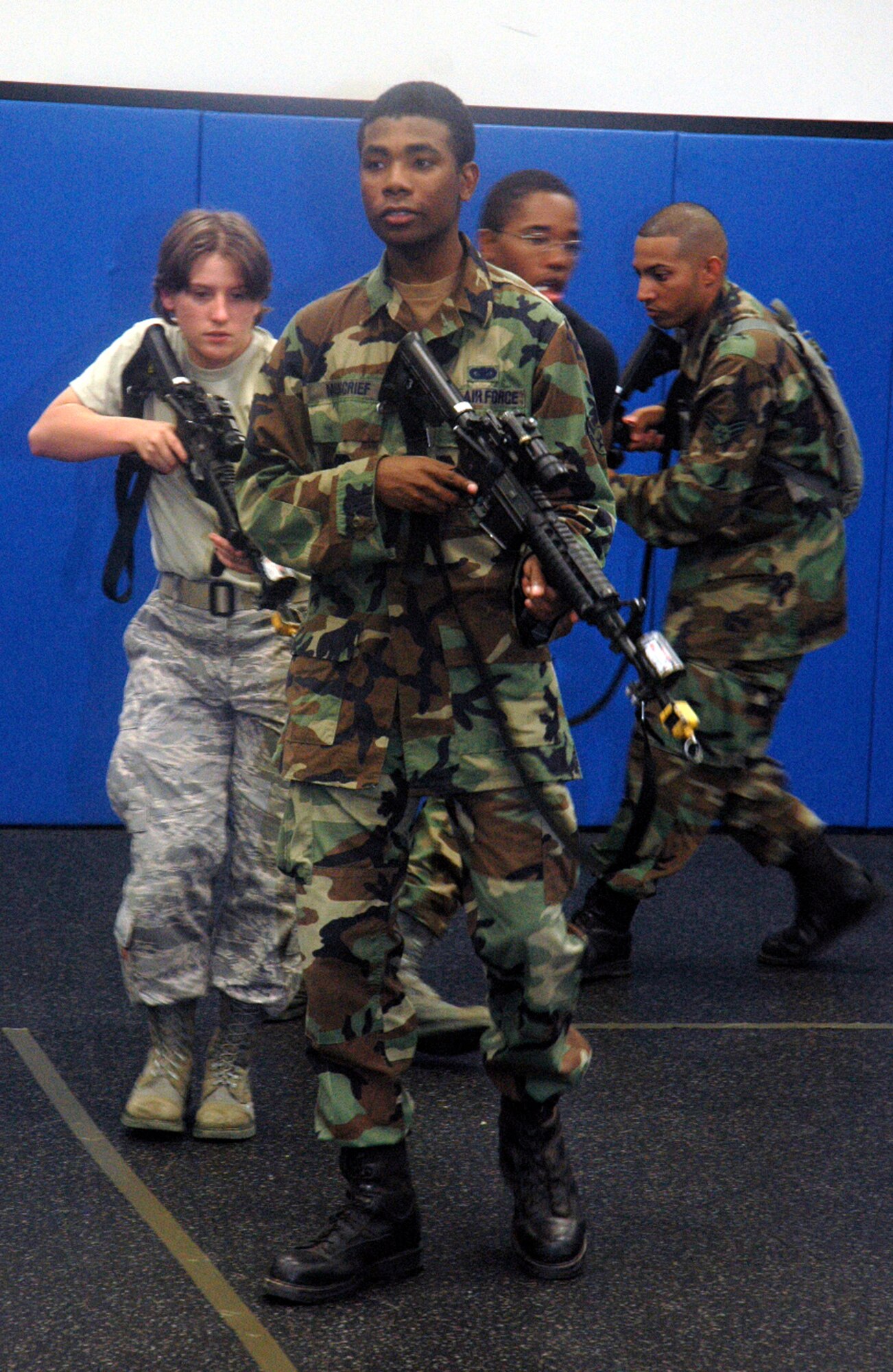 Students in the Air Force Phoenix Warrior Training Course 08-5 practice proper technique for military operations in urban terrain during a "tape drills" class in the U.S. Air Force Expeditionary Center on Fort Dix, N.J., June 5, 2008.  The course is taught by the USAF EC's Expeditionary Operations School and 421st Combat Training Squadron and prepares security forces Airmen for upcoming deployments. Annually, the USAF EC trains more than 23,000 students in expeditionary- and mobility air force-based courses both with in-residence and distance learning.  (U.S. Air Force Photo/Tech. Sgt. Scott T. Sturkol)