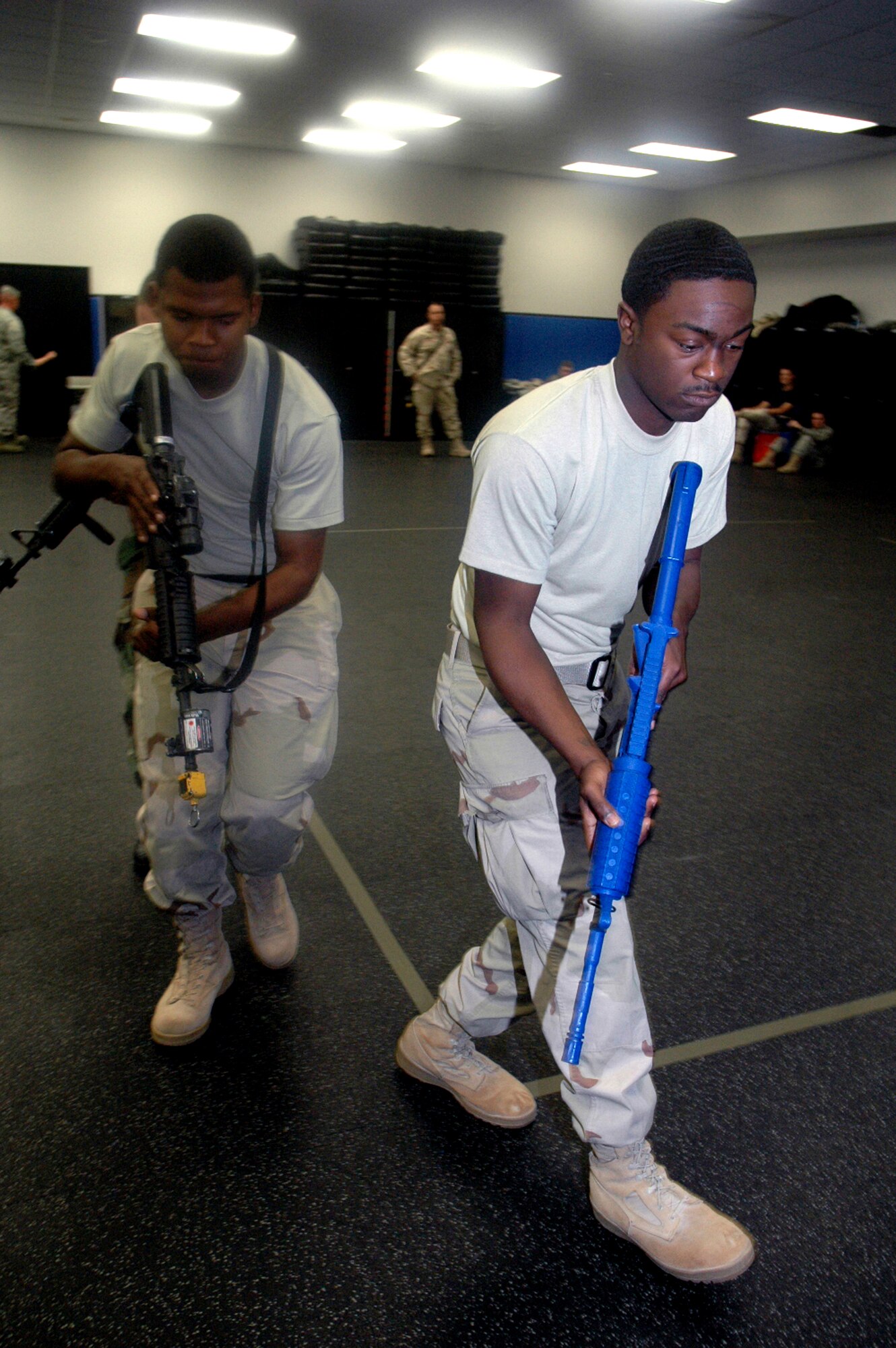 Students in the Air Force Phoenix Warrior Training Course 08-5 practice proper technique for military operations in urban terrain during a "tape drills" class in the U.S. Air Force Expeditionary Center on Fort Dix, N.J., June 5, 2008.  The course is taught by the USAF EC's Expeditionary Operations School and 421st Combat Training Squadron and prepares security forces Airmen for upcoming deployments. Annually, the USAF EC trains more than 23,000 students in expeditionary- and mobility air force-based courses both with in-residence and distance learning.  (U.S. Air Force Photo/Tech. Sgt. Scott T. Sturkol)