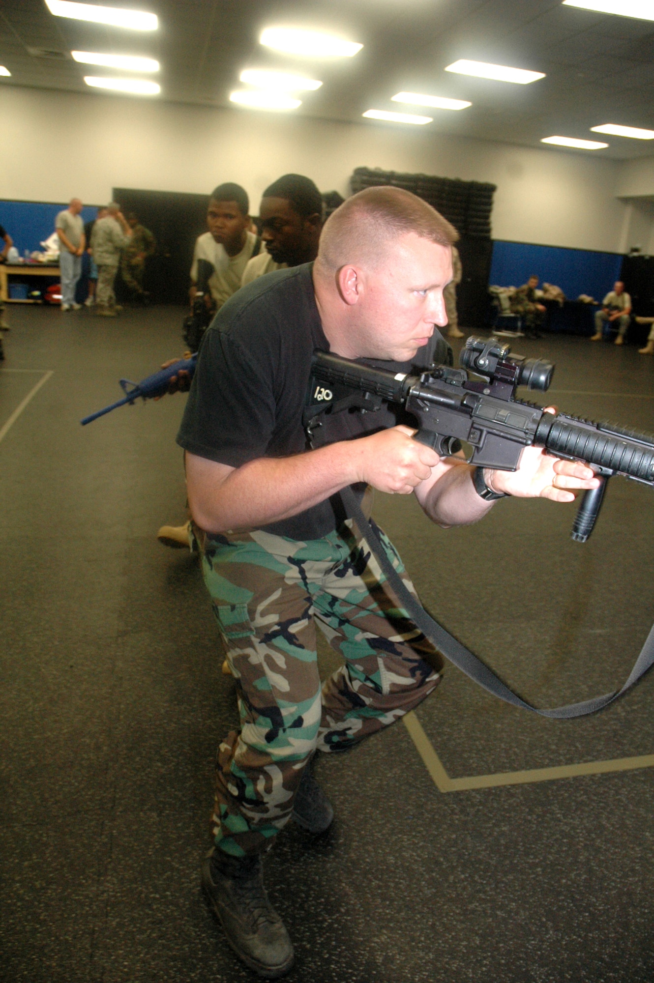 Students in the Air Force Phoenix Warrior Training Course 08-5 practice proper technique for military operations in urban terrain during a "tape drills" class in the U.S. Air Force Expeditionary Center on Fort Dix, N.J., June 5, 2008.  The course is taught by the USAF EC's Expeditionary Operations School and 421st Combat Training Squadron and prepares security forces Airmen for upcoming deployments. Annually, the USAF EC trains more than 23,000 students in expeditionary- and mobility air force-based courses both with in-residence and distance learning.  (U.S. Air Force Photo/Tech. Sgt. Scott T. Sturkol)