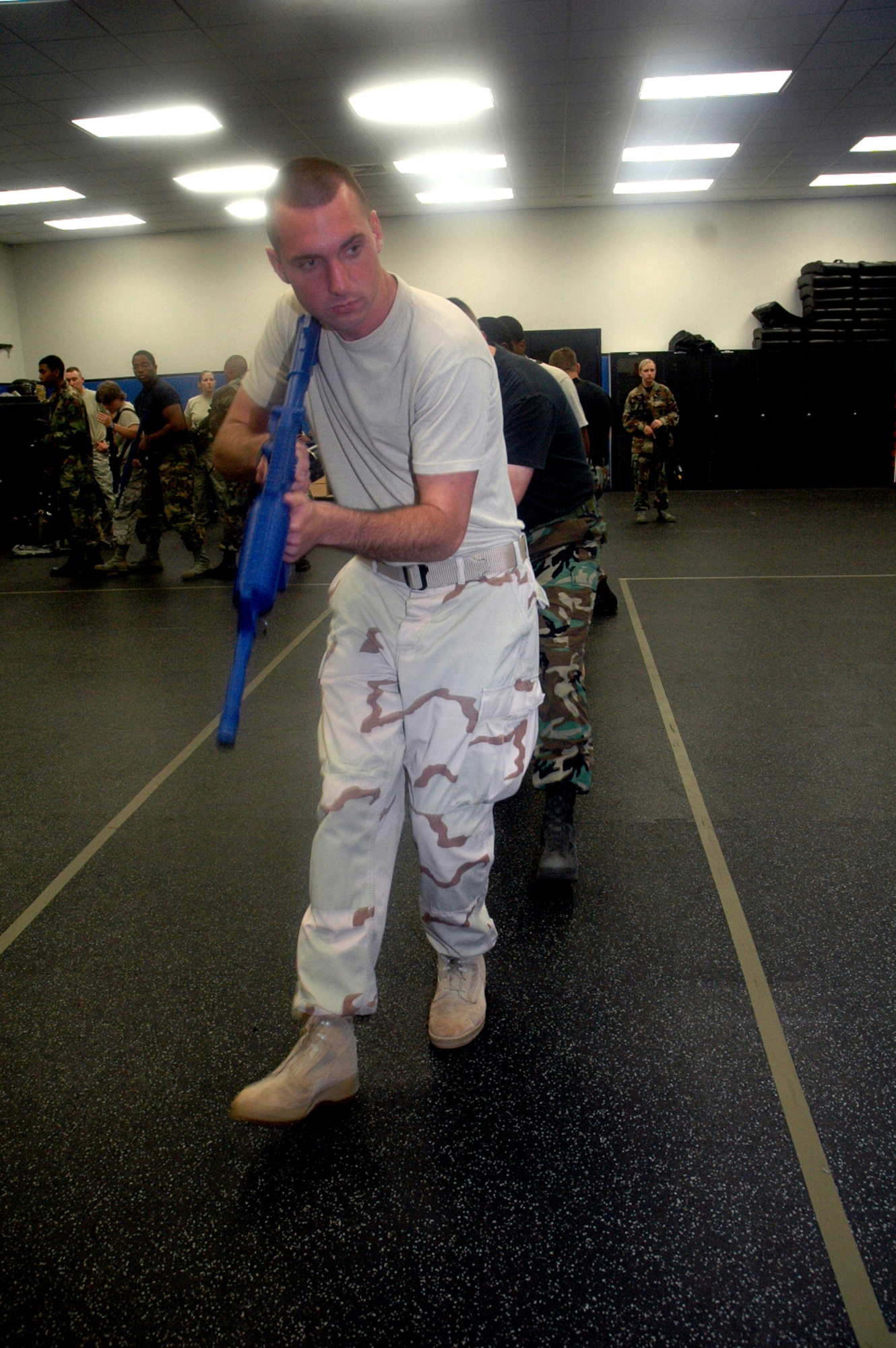 Students in the Air Force Phoenix Warrior Training Course 08-5 practice proper technique for military operations in urban terrain during a "tape drills" class in the U.S. Air Force Expeditionary Center on Fort Dix, N.J., June 5, 2008.  The course is taught by the USAF EC's Expeditionary Operations School and 421st Combat Training Squadron and prepares security forces Airmen for upcoming deployments. Annually, the USAF EC trains more than 23,000 students in expeditionary- and mobility air force-based courses both with in-residence and distance learning.  (U.S. Air Force Photo/Tech. Sgt. Scott T. Sturkol)