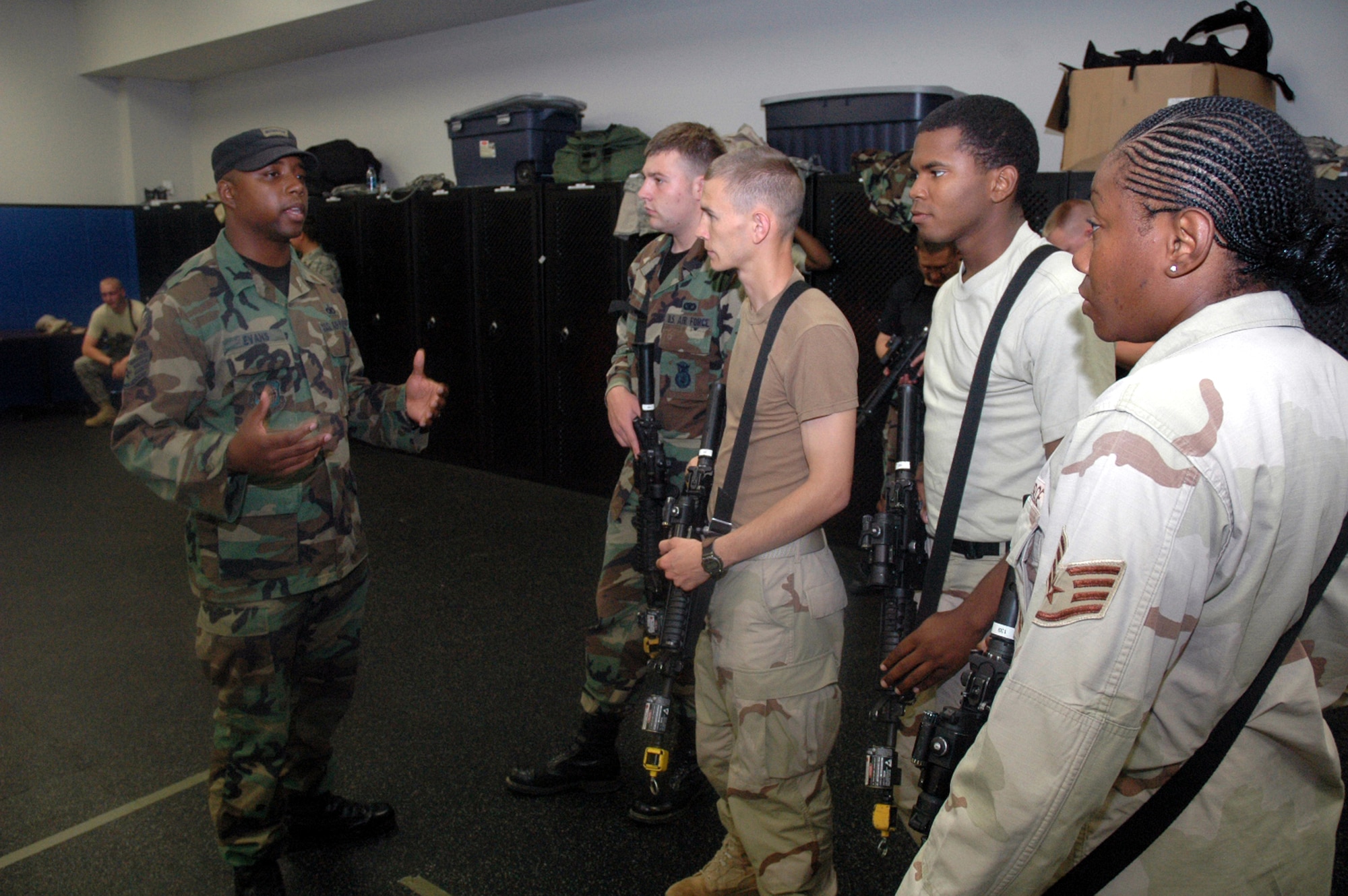 Instructor Staff Sgt. Cecil Evans shows students in the Air Force Phoenix Warrior Training Course 08-5 proper technique for military operations in urban terrain during a "tape drills" class in the U.S. Air Force Expeditionary Center on Fort Dix, N.J., June 5, 2008.  The course is taught by the USAF EC's Expeditionary Operations School and 421st Combat Training Squadron and prepares security forces Airmen for upcoming deployments. Annually, the USAF EC trains more than 23,000 students in expeditionary- and mobility air force-based courses both with in-residence and distance learning.  (U.S. Air Force Photo/Tech. Sgt. Scott T. Sturkol)