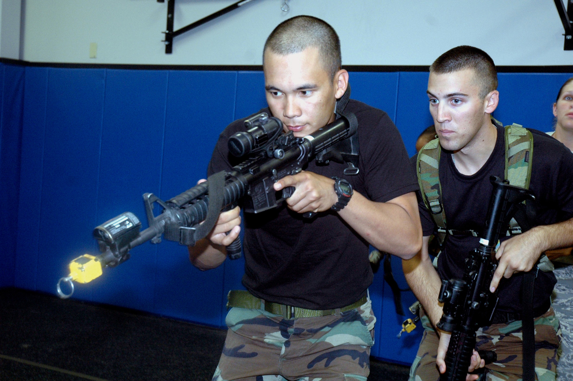 Students in the Air Force Phoenix Warrior Training Course 08-5 practice "tape drills" for a military operations in urban terrain class in the U.S. Air Force Expeditionary Center on Fort Dix, N.J., June 5, 2008.  The course is taught by the USAF EC's Expeditionary Operations School and 421st Combat Training Squadron and prepares security forces Airmen for upcoming deployments. Annually, the USAF EC trains more than 23,000 students in expeditionary- and mobility air force-based courses both with in-residence and distance learning.  (U.S. Air Force Photo/Tech. Sgt. Scott T. Sturkol)