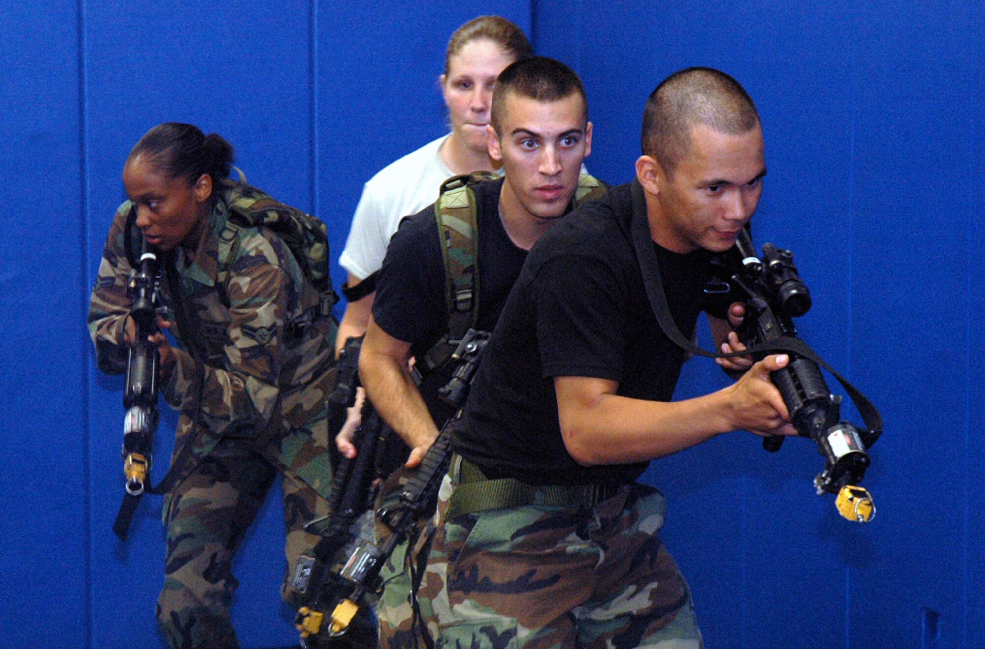 Students in the Air Force Phoenix Warrior Training Course 08-5 practice "tape drills" for a military operations in urban terrain class in the U.S. Air Force Expeditionary Center on Fort Dix, N.J., June 5, 2008.  The course is taught by the USAF EC's Expeditionary Operations School and 421st Combat Training Squadron and prepares security forces Airmen for upcoming deployments. Annually, the USAF EC trains more than 23,000 students in expeditionary- and mobility air force-based courses both with in-residence and distance learning.  (U.S. Air Force Photo/Tech. Sgt. Scott T. Sturkol)