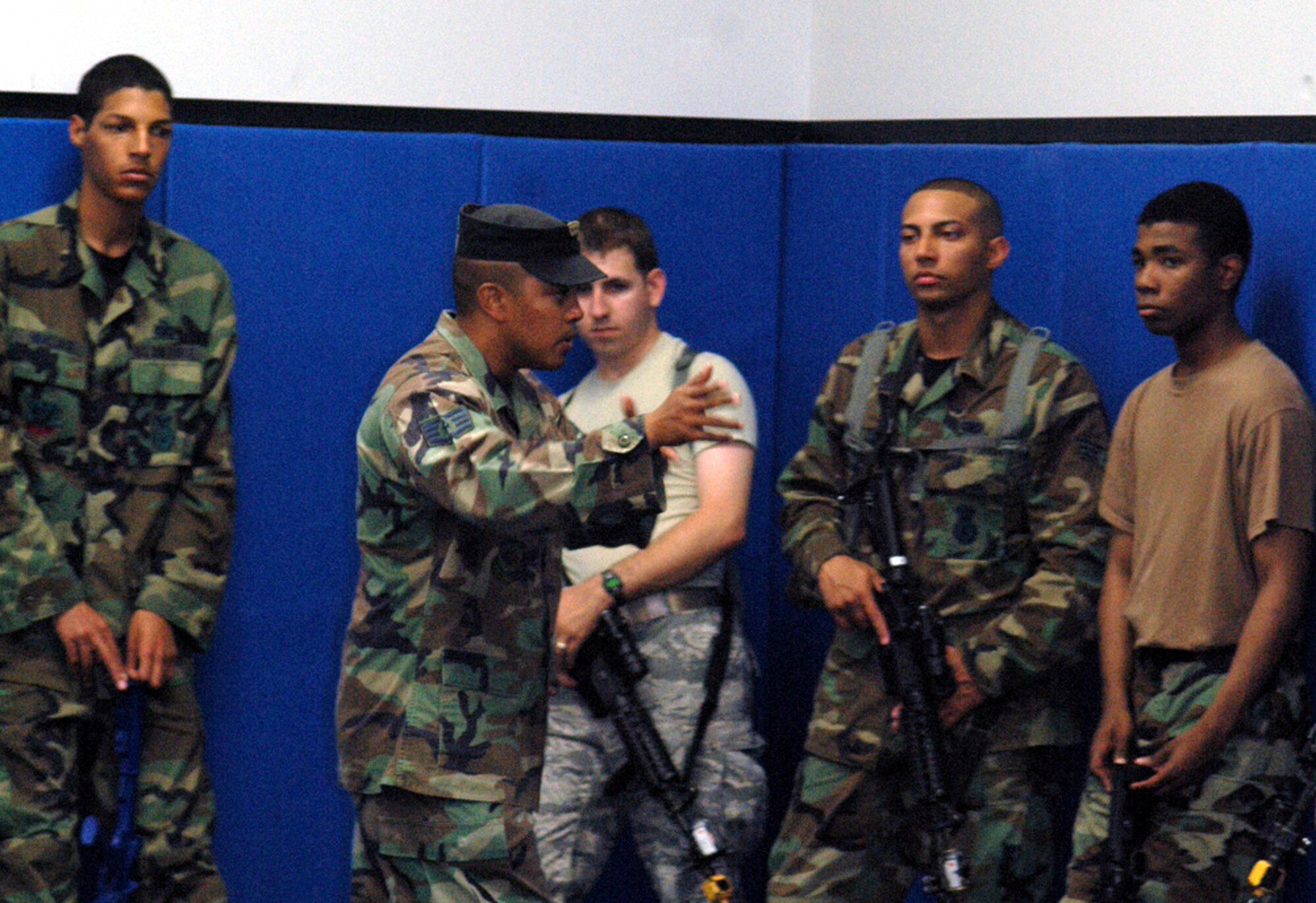 Instructor Staff Sgt. Nelson Brown shows students in the Air Force Phoenix Warrior Training Course 08-5 proper technique for military operations in urban terrain during a "tape drills" class in the U.S. Air Force Expeditionary Center on Fort Dix, N.J., June 5, 2008.  The course is taught by the USAF EC's Expeditionary Operations School and 421st Combat Training Squadron and prepares security forces Airmen for upcoming deployments. Annually, the USAF EC trains more than 23,000 students in expeditionary- and mobility air force-based courses both with in-residence and distance learning.  (U.S. Air Force Photo/Tech. Sgt. Scott T. Sturkol)