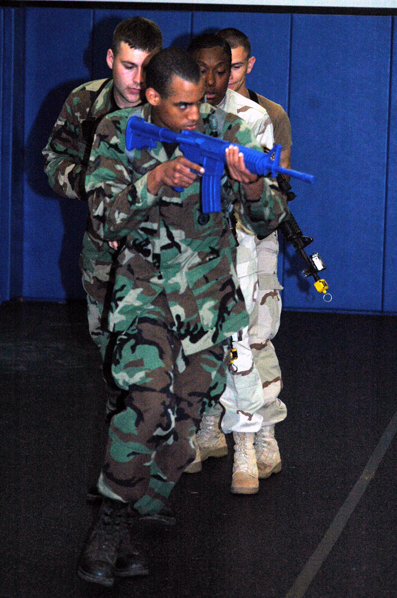 Students in the Air Force Phoenix Warrior Training Course 08-5 practice "tape drills" for a military operations in urban terrain class in the U.S. Air Force Expeditionary Center on Fort Dix, N.J., June 5, 2008.  The course is taught by the USAF EC's Expeditionary Operations School and 421st Combat Training Squadron and prepares security forces Airmen for upcoming deployments. Annually, the USAF EC trains more than 23,000 students in expeditionary- and mobility air force-based courses both with in-residence and distance learning.  (U.S. Air Force Photo/Tech. Sgt. Scott T. Sturkol)