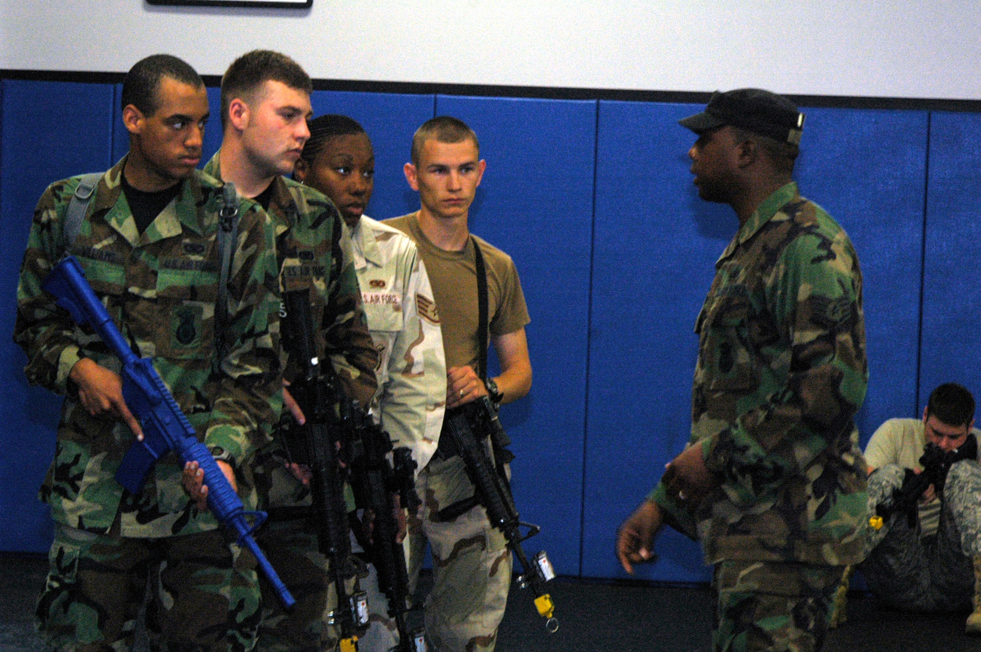 Instructor Staff Sgt. Cecil Evans shows students in the Air Force Phoenix Warrior Training Course 08-5 proper technique for military operations in urban terrain during a "tape drills" class in the U.S. Air Force Expeditionary Center on Fort Dix, N.J., June 5, 2008.  The course is taught by the USAF EC's Expeditionary Operations School and 421st Combat Training Squadron and prepares security forces Airmen for upcoming deployments. Annually, the USAF EC trains more than 23,000 students in expeditionary- and mobility air force-based courses both with in-residence and distance learning.  (U.S. Air Force Photo/Tech. Sgt. Scott T. Sturkol)