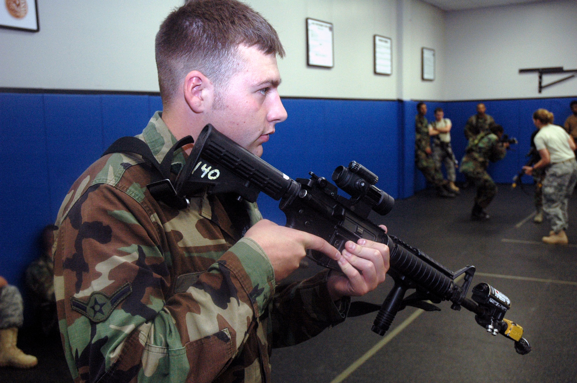 A student in the Air Force Phoenix Warrior Training Course 08-5 practices technique for military operations in urban terrain during a "tape drills" class in the U.S. Air Force Expeditionary Center on Fort Dix, N.J., June 5, 2008.  The course is taught by the USAF EC's Expeditionary Operations School and 421st Combat Training Squadron and prepares security forces Airmen for upcoming deployments. Annually, the USAF EC trains more than 23,000 students in expeditionary- and mobility air force-based courses both with in-residence and distance learning.  (U.S. Air Force Photo/Tech. Sgt. Scott T. Sturkol)