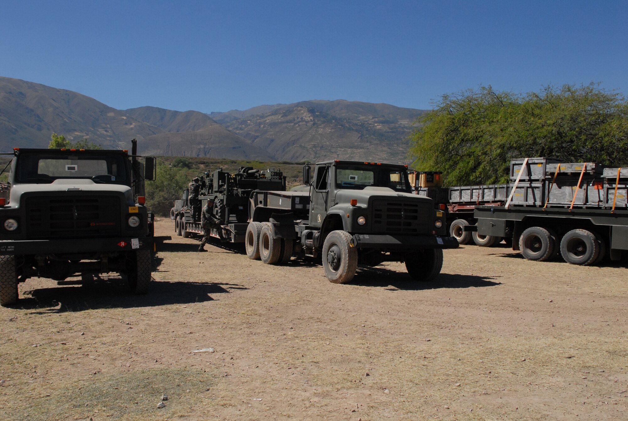 U.S. Navy servicemembers, deployed from Golf Port, Miss., unload equipment at the construction site in Huanta, Peru, where wells are being built in support of New Horizons Peru 2008, a humanitarian event that benefits underprivileged Peruvians. U.S. Air Force, Army, Marines, and Navy servicemembers came together to build new schools, clinics, and water wells which will accommodate nearly 5,200 Peruvians. (U.S. Air Force photo/Airman 1st Class Tracie Forte)