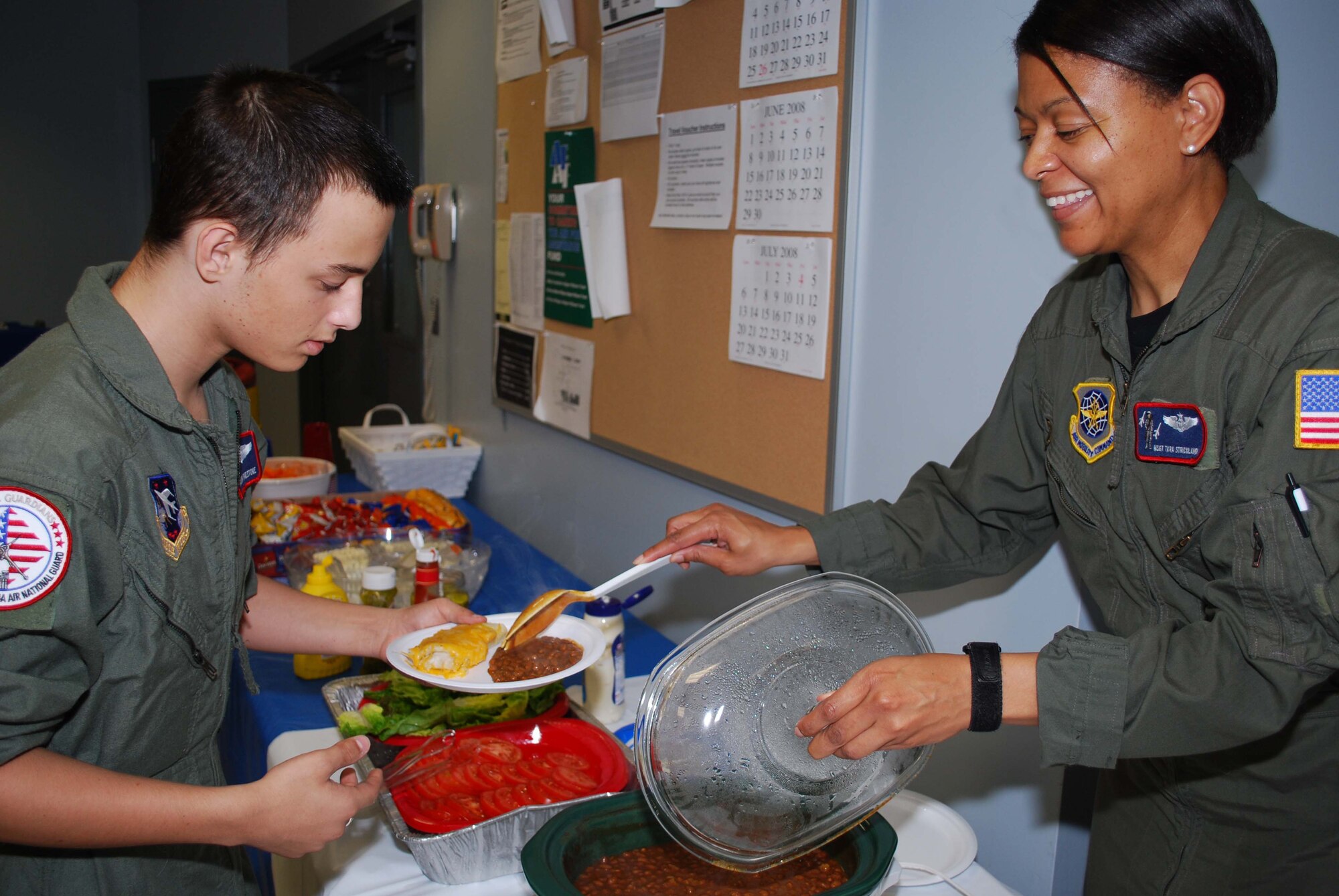 ANDREWS AIR FORCE BASE, Md. -- Zachary Finestone, 14, receives a helping of lunch during Team Andrews's Pilot for a Day program here June 5. Coordinated through the Air Force Reserve Command's 459th Air Refueling Wing and the District of Columbia Air National Guard's 113th Wing, Pilot for a Day or "P4D" is a community outreach program that allows military and civilian children of all ages who suffer from serious or chronic medical conditions to visit an installation for the day to tour wing and base facilities. (U.S. Air Force photo/Tech. Sgt. Amaani Lyle)