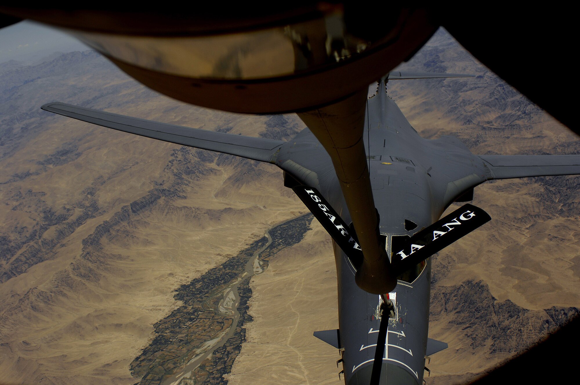 An Air Force B-1B Lancer aircraft moves into position to receive fuel May 27 from a KC-135R Stratotanker during a mission over Afghanistan. The B-1B is deployed from Ellsworth Air Force Base S.D. and the KC-135R is assigned to the 22nd Expeditionary Air Refueling Squadron, 376th Air Expeditionary Wing and is deployed from the 174th Air Refueling Squadron, Iowa Air National Guard, Sioux City, Iowa. (U.S. Air Force photo/Master Sgt. Andy Dunaway)