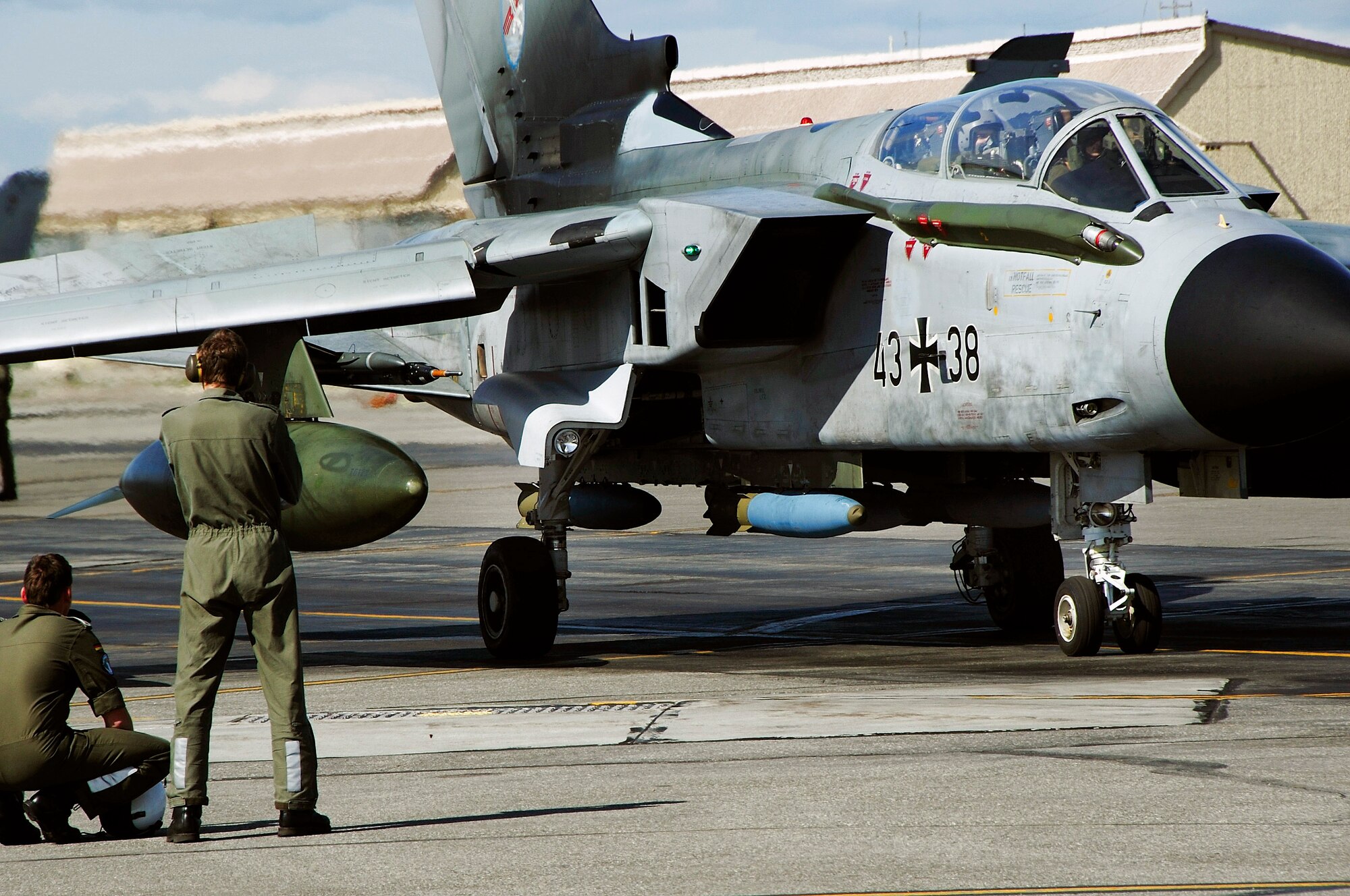 German crew chiefs watch a Tornado prepare to take off during Red Flag-Alaska 08-3 June 9. Coordinating the training is the responsibility of Airmen with the 353rd Combat Training Squadron at Eielson Air Force Base, Alaska. Coalition and American pilots, aircrews and support members are able to train in a realistic environment during the exercise. (U.S. Air Force photo/Airman 1st Class Christopher Griffin) 