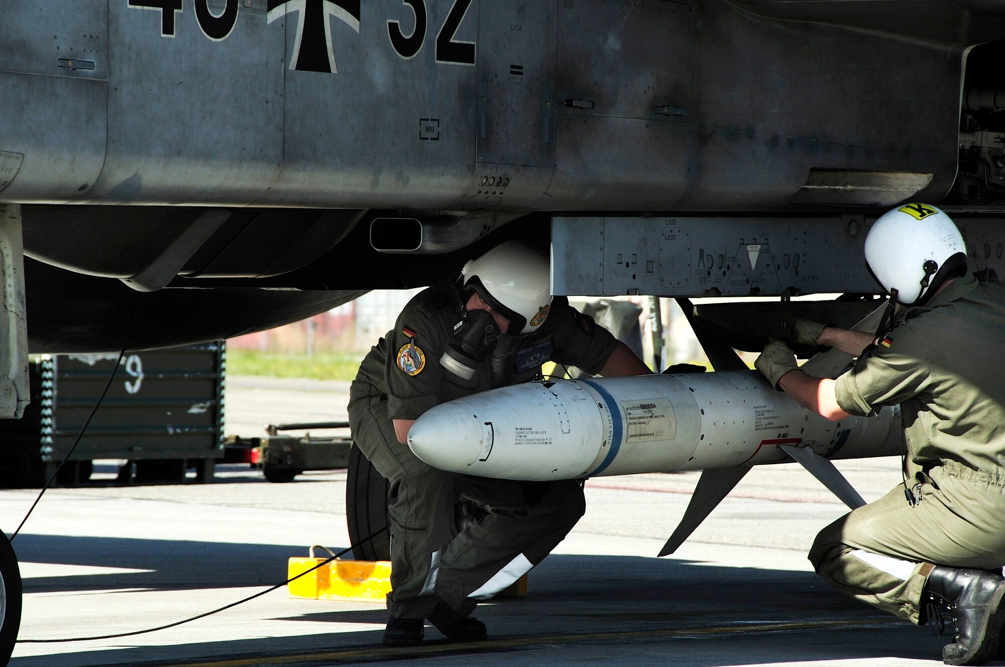 Two German crew chiefs prepare a Tornado for take off to participate in Red Flag-Alaska 08-3 June 9 at Eielson Air Force Base, Alaska. Red Flag-Alaska is a series of Pacific Air Forces commander-directed field training exercises for U.S. forces, providing joint offensive counter-air, interdiction, close-air-support and large-force-employment training in a simulated combat environment. (U.S. Air Force photo/Airman 1st Class Christopher Griffin) 