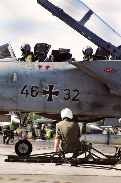 Two German Air Force pilots go through a pre-flight inspection June 9 at Eielson Air Force Base, Alaska. The Germans are participating in Red Flag-Alaska 08-3, a 10-day air combat training exercise held up to four times a year over Alaskan and Western Canadian airspace. The training helps pilots, aircrews and support members overcome the differences that might arise in the area of responsibility when working with foreign countries in combat situations. (U.S. Air Force photo/Airman 1st Class Christopher Griffin) 