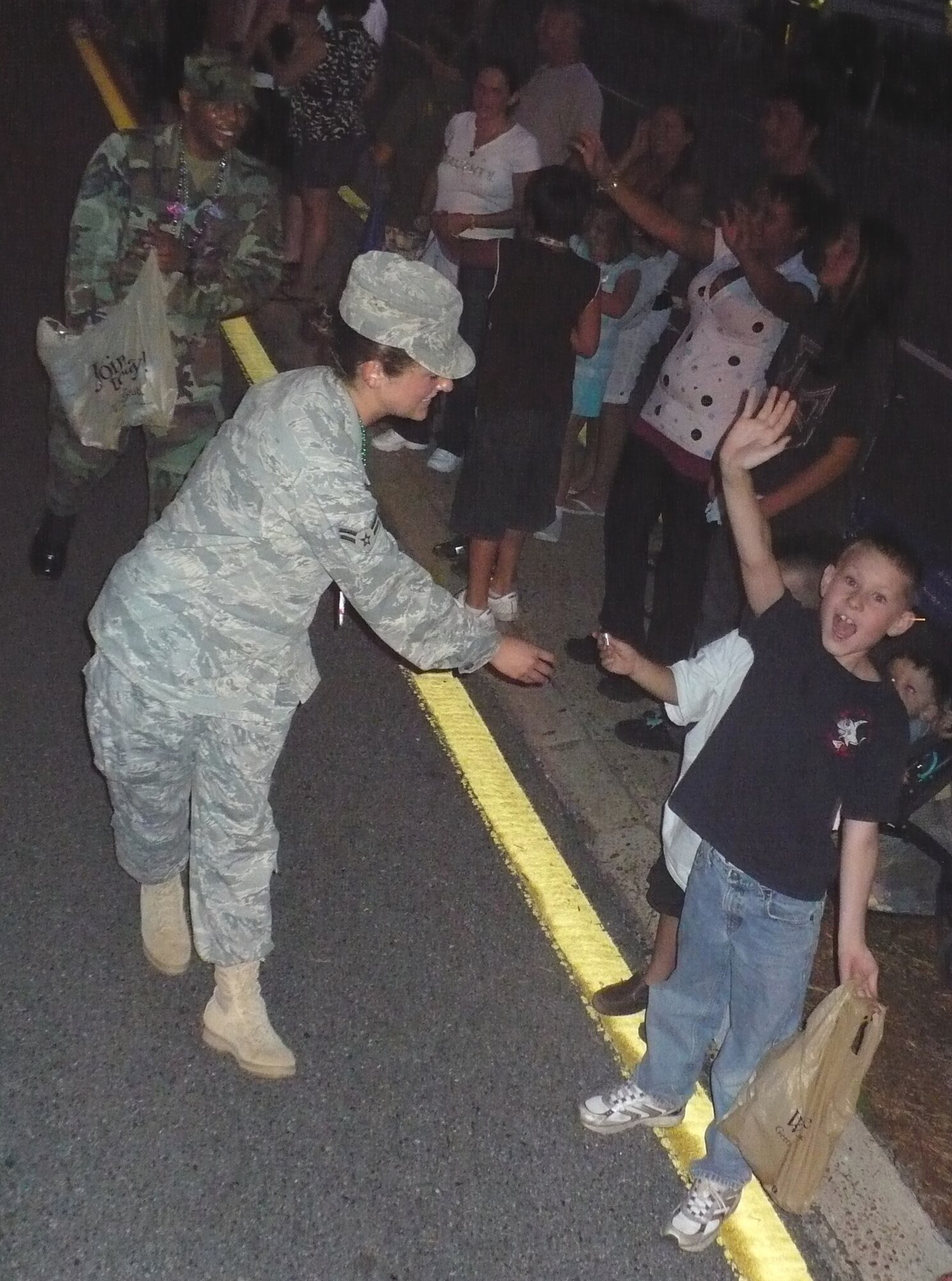 Hurlburt Field Airmen pass out candy to children gathered along Eglin Parkway during the Billy Bowlegs parade June 9. Billy Bowlegs is an annual four-day pirate-themed festival, culminating in a parade. 