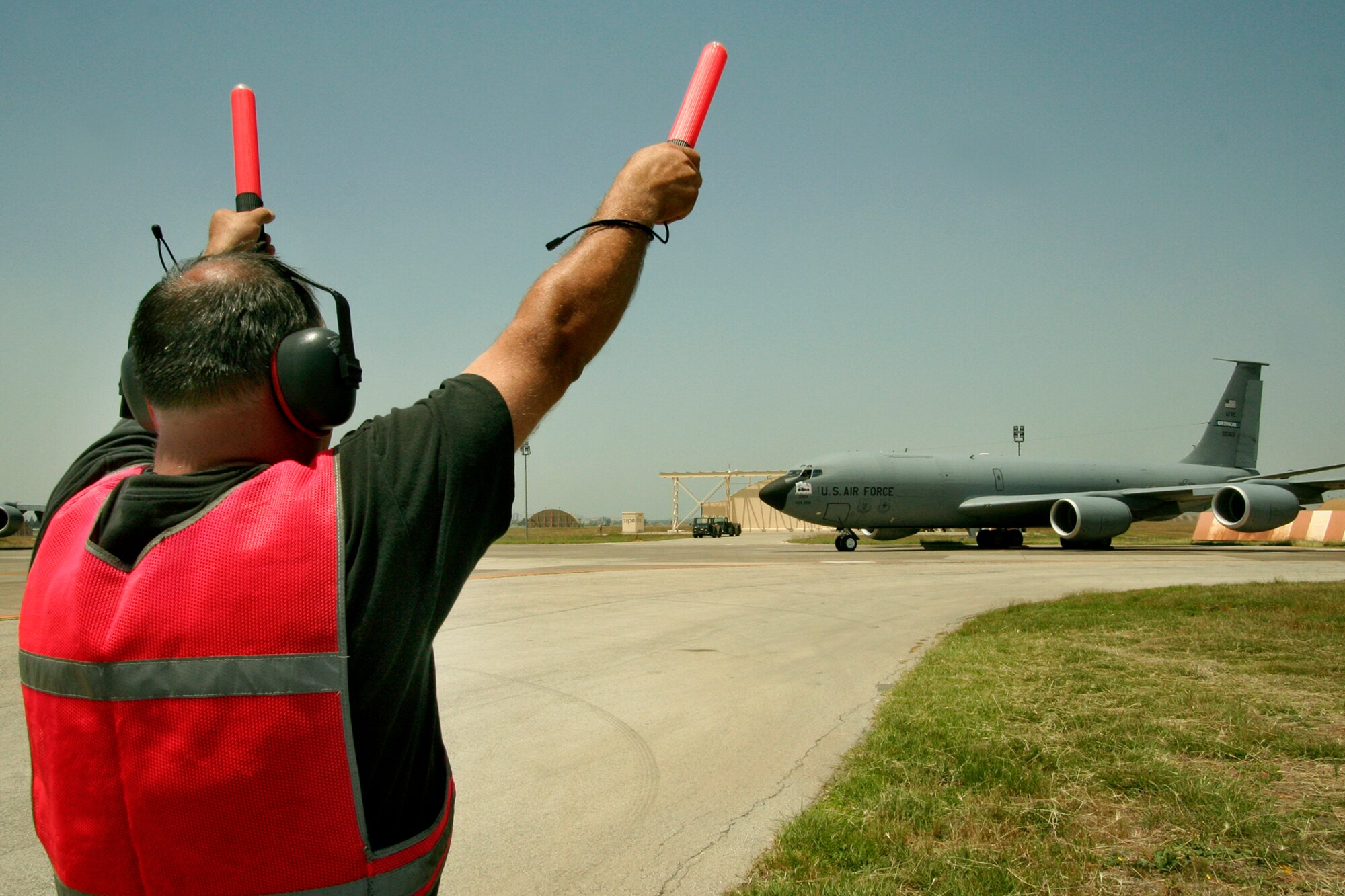 INCIRLIK AIR BASE, TURKEY-- Senior Master Sgt. Brian Mackey, a quality inspector with the 434th Maintenance Group, marshals a KC-135 Stratotanker as it departs from Incirlik back to Grissom Air Reserve Base, Ind. Airmen from Grissom are completing the deployment in rotations to Turkey to maximize training opportunities.  (U.S. Air Force Photo/Tech. Sgt. Patrick Kuminecz) 
