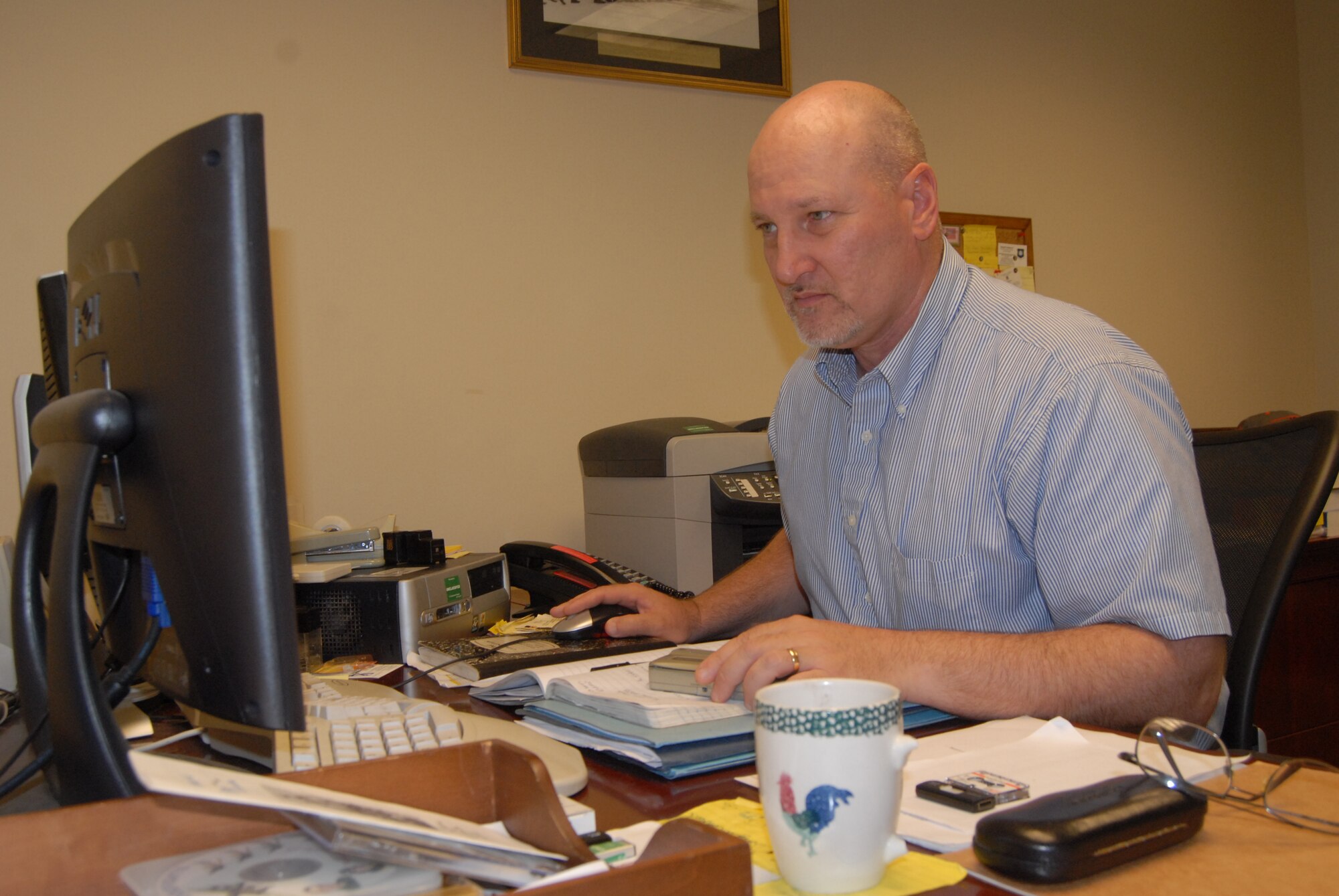 Keith Alexander, 43rd Airlift Wing historian, transcribes an interview from his tape recorder to his computer at his work station Monday. As a wing historian, he must collect, organize, safeguard and preserve historically significant data pertaining to Pope’s mission. (U.S. Air Force Photo by Airman 1st Class Mindy Bloem)
