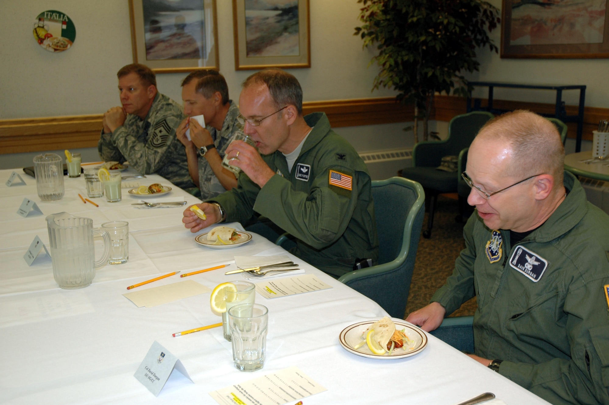 Judges of the Warrior Chef competition, Chief Master Sgt. Steve Sargent, 341st Space Wing command chief; Col. Roderick Davis, 341st Mission Support Group commander; Col. Michael Fortney, 341st Space Wing commander; and Col. David Durgan, 314st Operations Group commander, sample barbecue shrimp fajitas and avocado milkshakes, prepared by Senior Airman Lyndon Moore and Staff Sgt. Melissa Garrido, 564th Missile Squadron chefs. The Warrior Chef competition was held June 10 at the Elkhorn Diner. (U.S. Air Force photo/Airman 1st Class Emerald Ralston)