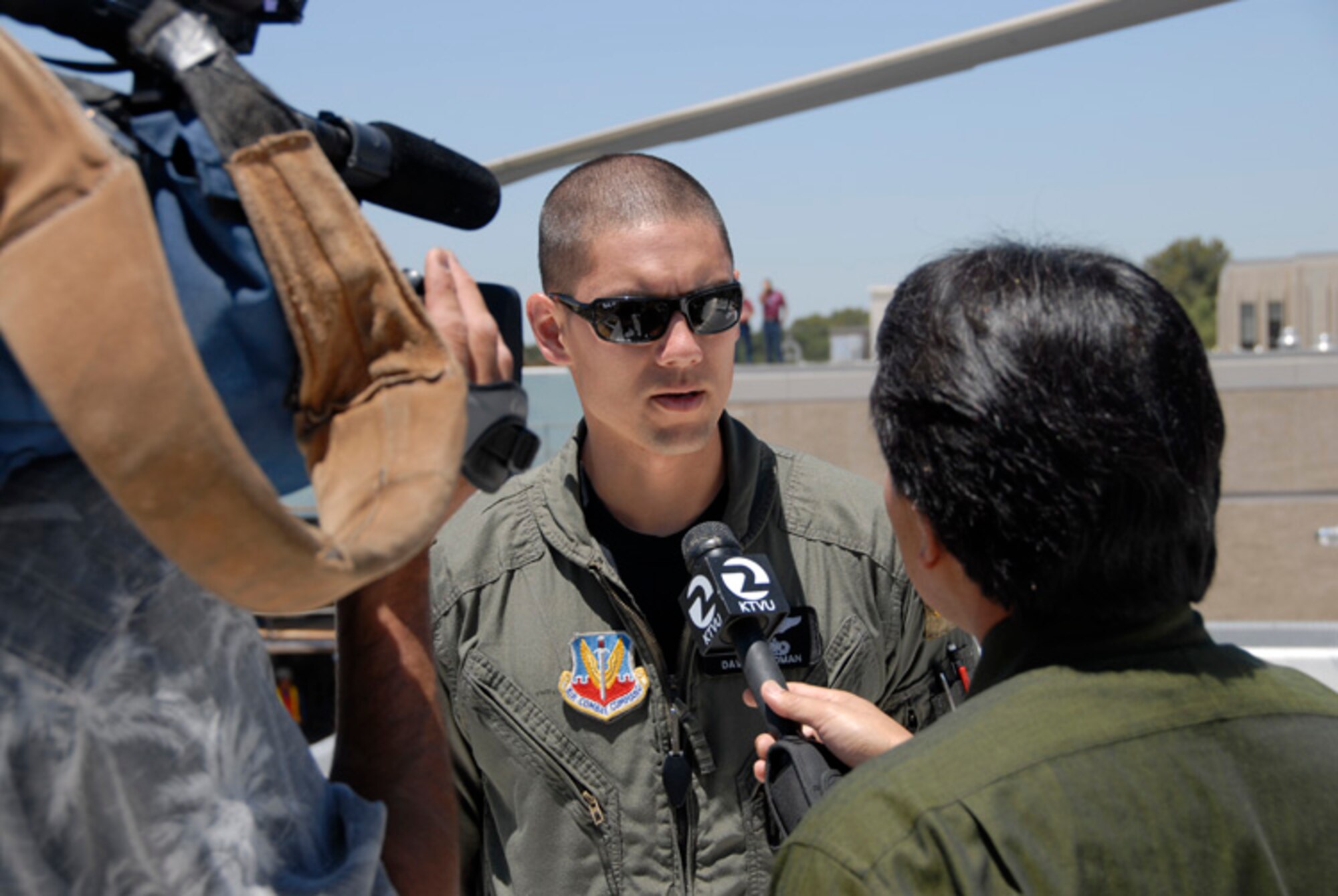 Capt Dave Weidman, an HH-60G Pave Hawk pilot from the 129th Rescue Wing, Moffett Field, California is interviewed byt KTVU Channel 2 reporter Robert Handa about the advantages to having a new helipad available in San Jose Regional Medical Hospital (U.S. Air Force photo by Staff Sgt. Andrew Hughan)