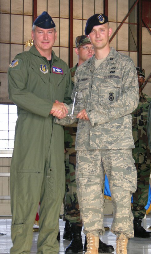 SEYMOUR JOHNSON AIR FORCE BASE, N.C. -- Capt. Jason Westmeyer (right) is recognized by Col. Fritz Linsenmeyer, commander of the 916th Air Refueling Wing as the Company Grade Officer of the Quarter for January-March 2008. Capt. Westmeyer is a Reservist with the 916th Security Forces Squadron. U.S. Air Force photo/TSgt. Scotty Sweatt