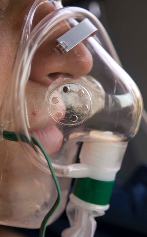 Man using oxygen mask.