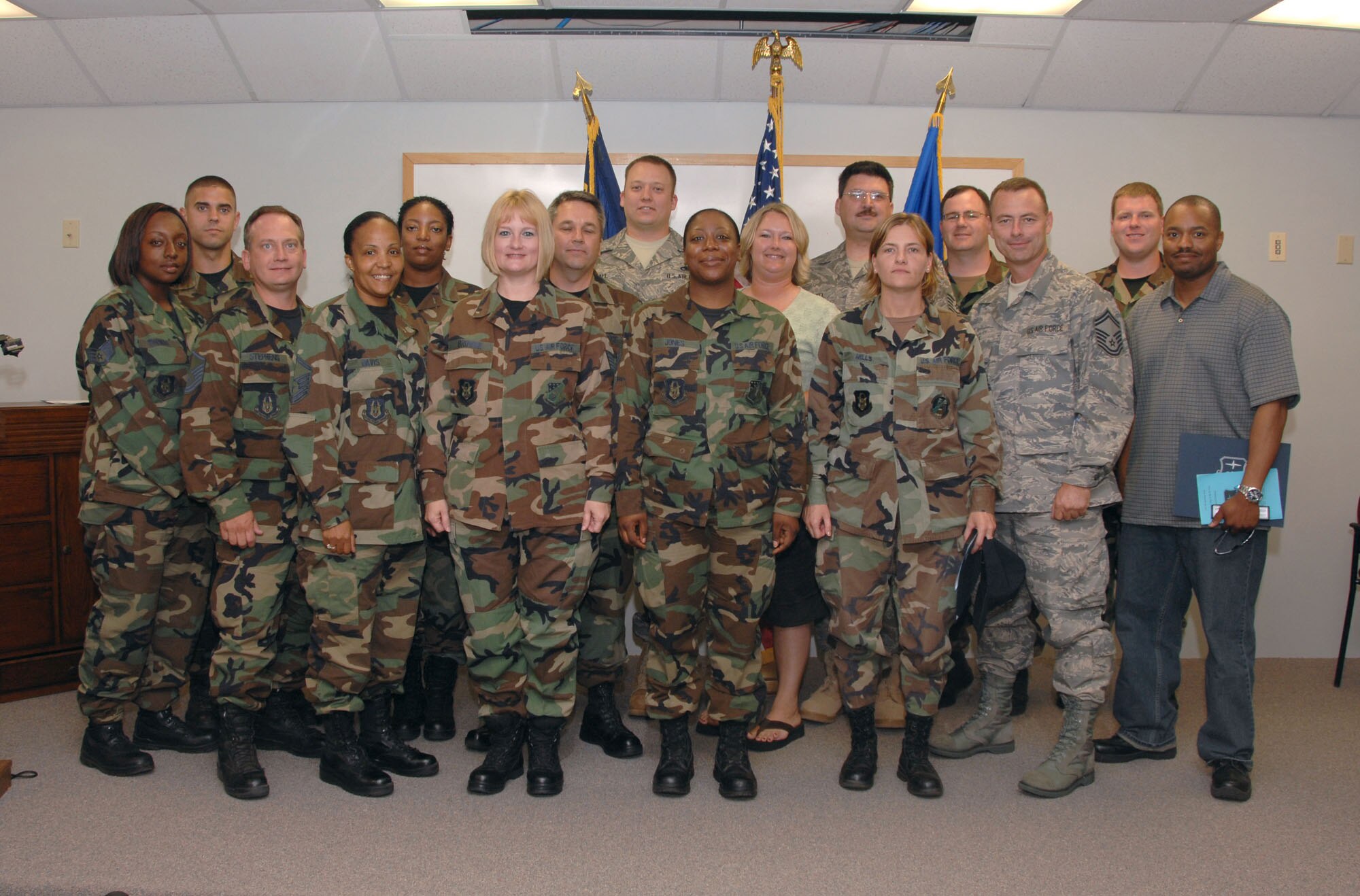 SEYMOUR JOHNSON AIR FORCE BASE, N.C. --Graduates from the Community College of the Air Force pose after getting their diplomas at Seymour Johnson AFB, N.C. June 8.  More than 16 reservists from the 916th Air Refueling Wing completed their associates in applied science degrees. (U.S. Air Force photo by TSgt. Gillian M. Albro, 916th ARW/PA)