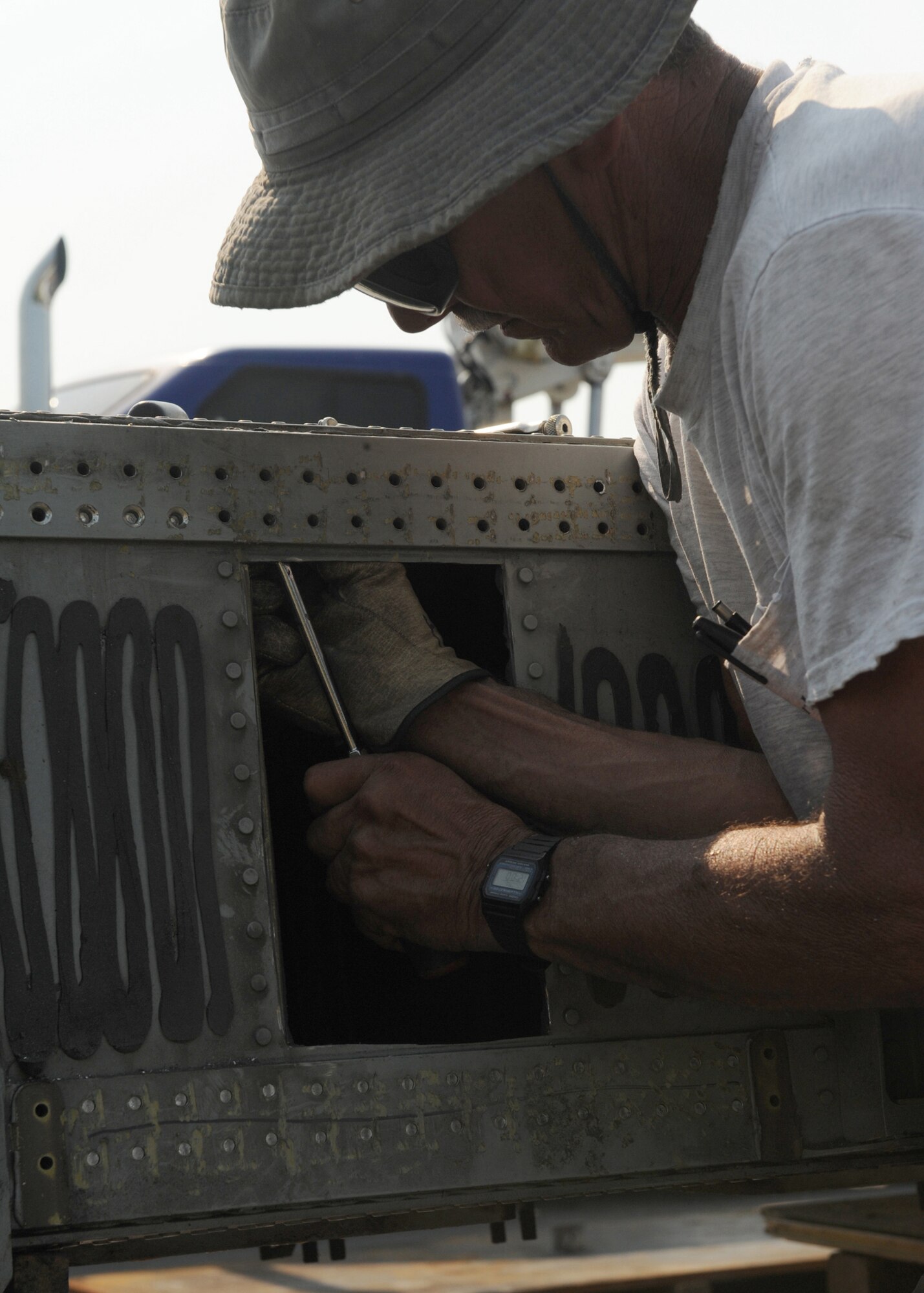 Jim Hale, a employee from Worldwide Aircraft Deliveries Ltd, cleans the spar for attachment to the pile on mount on the wing of an A-10 aircraft here on June 6. The A-10 is going to be part of the static displays on base.(US Air Force photo by A1C Ciara Wymbs)
