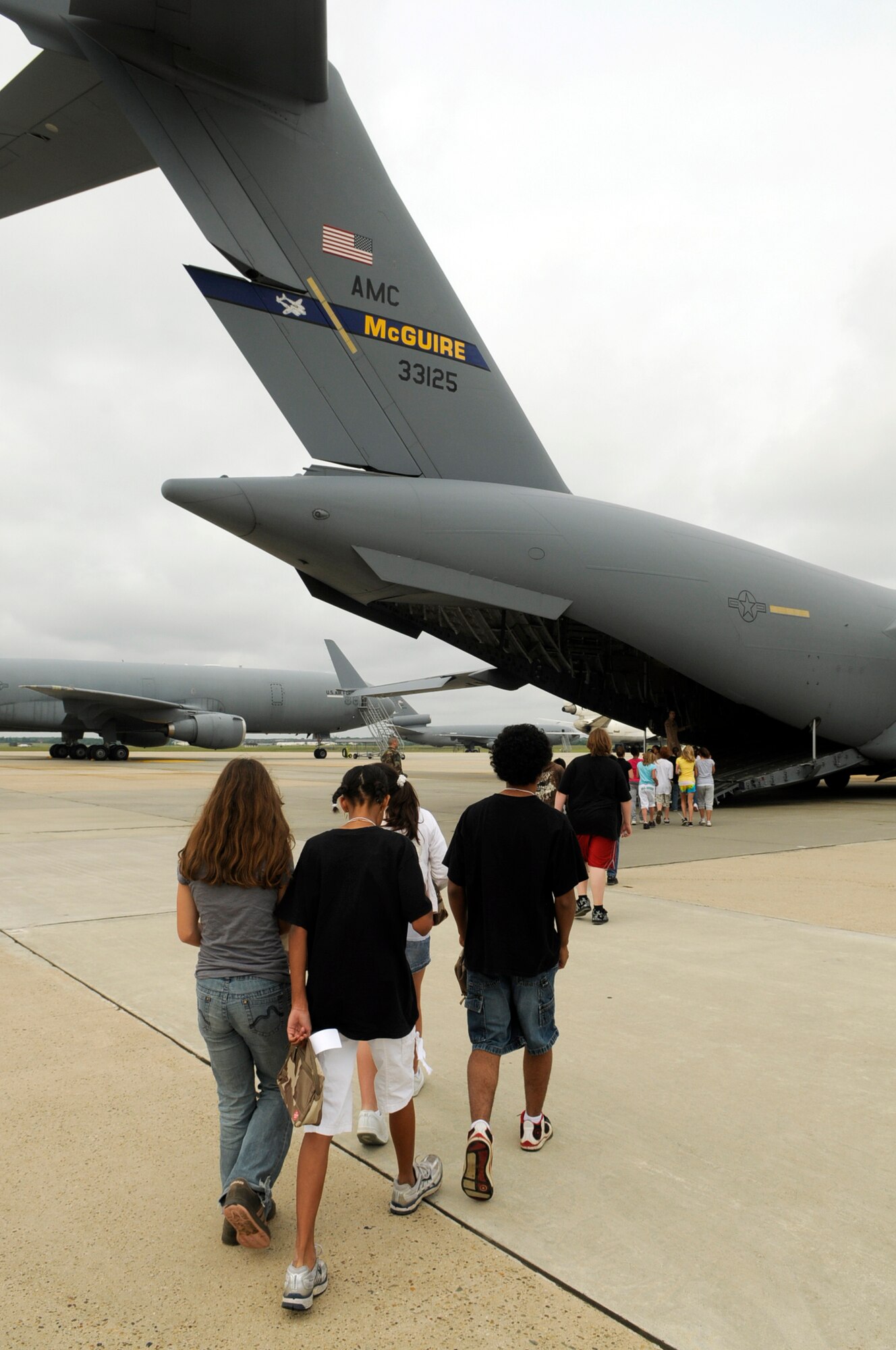 Students from Upper Elementary School in North Hanover walk up to a McGuire C-17 Globemaster III for their simulated 13-hour flight to “Camp Camel”. The students took part in a mobility line that culminated with their simulated trip to Saudi Arabia. The field trip gave the sixth grade students a perspective of the troops who deploy for contingencies. (U.S. Air Force photo/Kenn Mann)