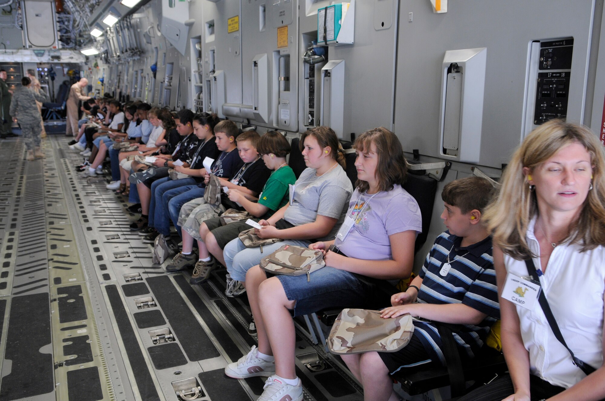 Students from Upper Elementary School in North Hanover are seated during their simulated 13-hour flight in a McGuire C-17 Globemaster III to “Camp Camel”. The students took part in a mobility line that culminated with their simulated trip to Saudi Arabia. The field trip gave the sixth grade students a perspective of the troops that deploy for contingencies. (U.S. Air Force photo/Kenn Mann)