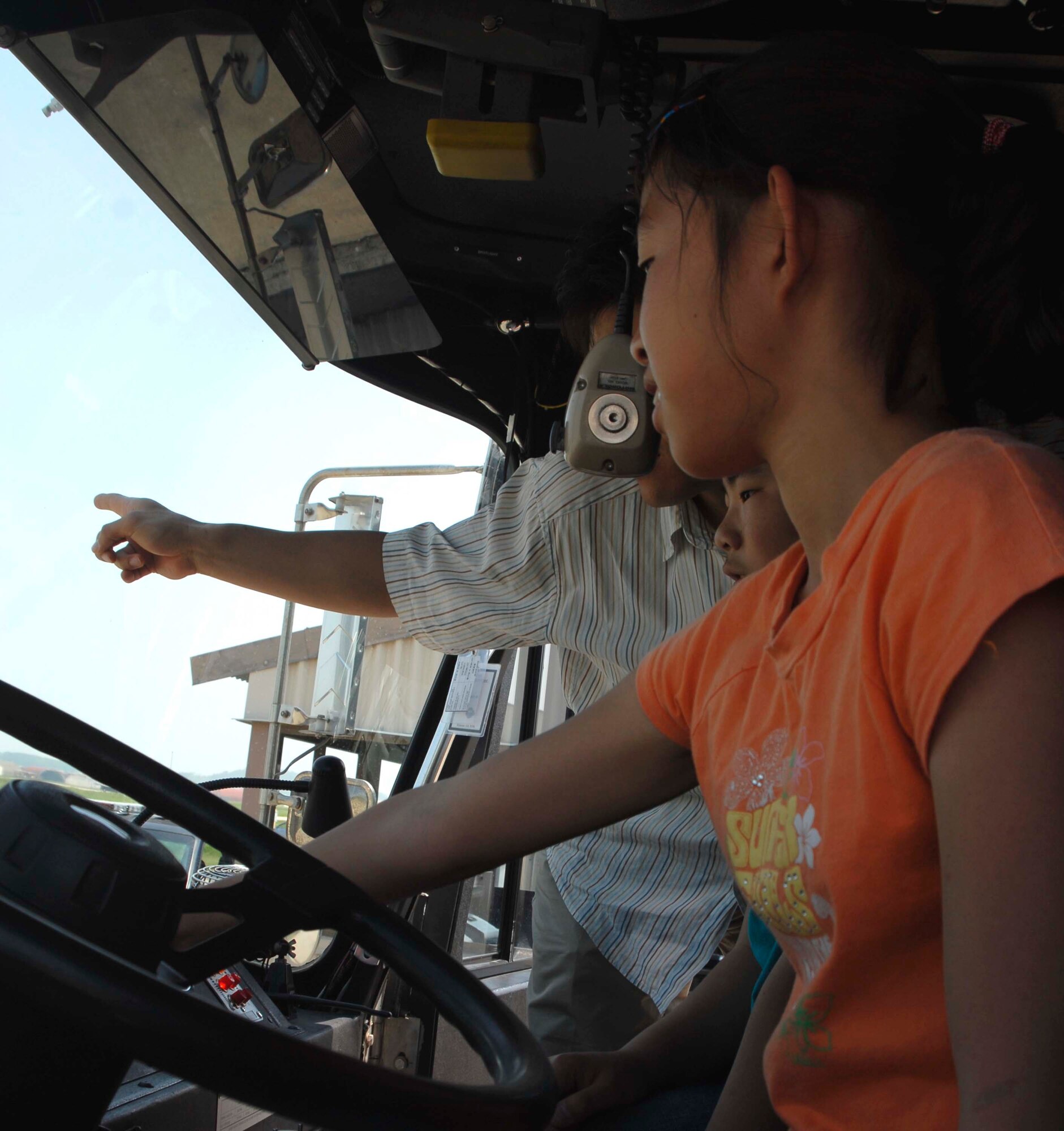 KUNSAN AIR BASE, Republic of Korea—Students form Seonyeon Elementary School in Kunsan City, Korea get a tour of the inside of a fire truck here June 12. The base tour gave the children an opportunity to see the Fighting Falcon up-close, interact with pilots, tour the base fire station and 8th Security Forces Squadron K-9 Kennel. 