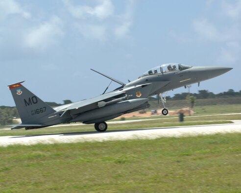 ANDERSEN AIR FORCE BASE, Guam-- An F-15E Strike Eagle touches down here June 4. The F-15s from Mountain Home Air Force Base, Idaho, make up the 389th Expeditionary Fighter Squadron. A total of 12 F-15s are deployed here for four months for their scheduled AEF rotation. (U.S. Air Force by Airman 1st Class Cory Todd)