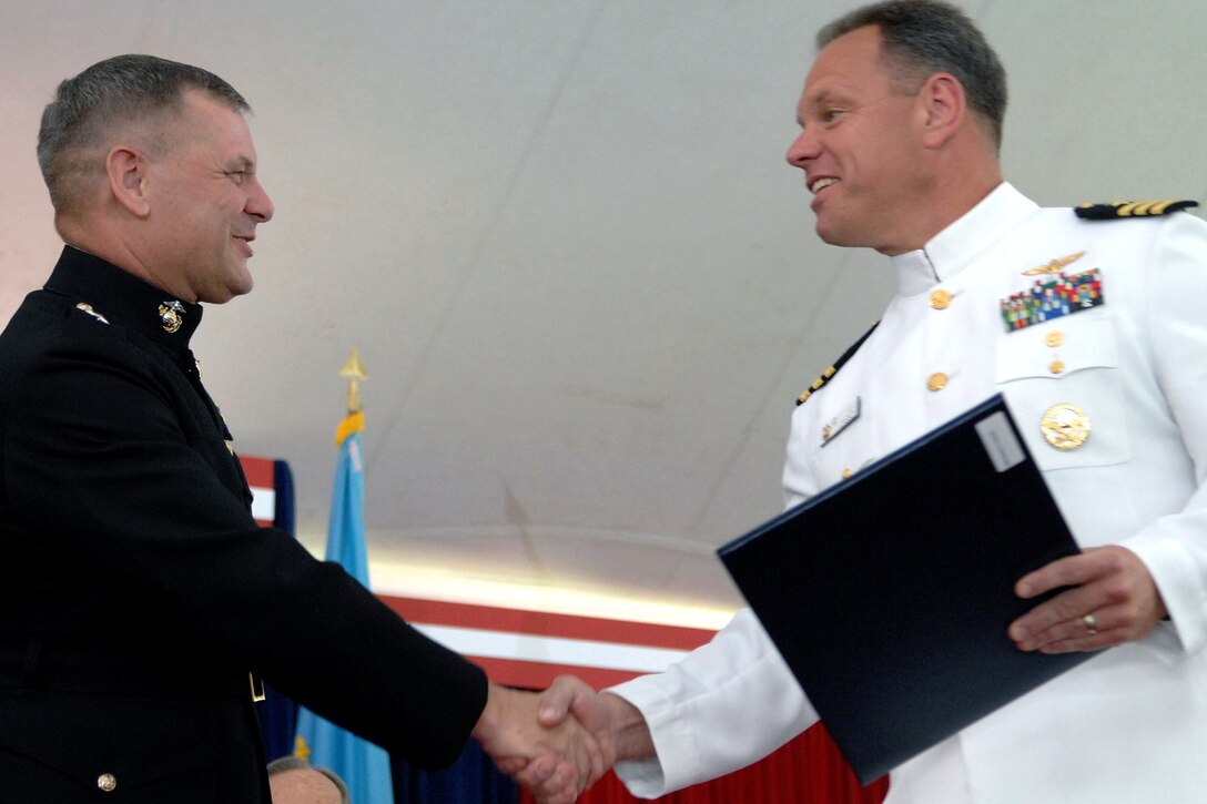 U.S. Marine Gen. James E. Cartwright, vice chairman of the Joint Chiefs of Staff, congratulates Navy Cmdr. C.J. Cassidy at the National Defense University graduation on Fort Lesley J. McNair, Washington, D.C., June 12, 2008. 