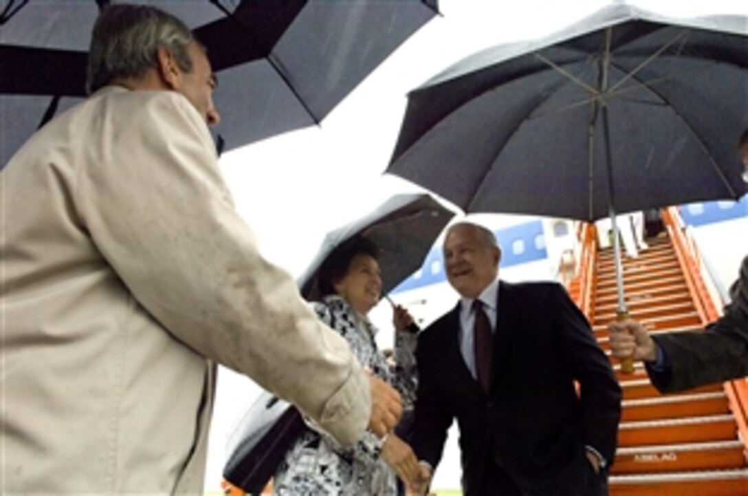 U.S. Defense Secretary Robert M. Gates meets Bruce Weinrod, left, and U.S. Ambassador to NATO Victoria Nuland upon his arrival in Brussels, Belgium, June 12, 2008. Gates is in Belgium to attend meetings of NATO. 