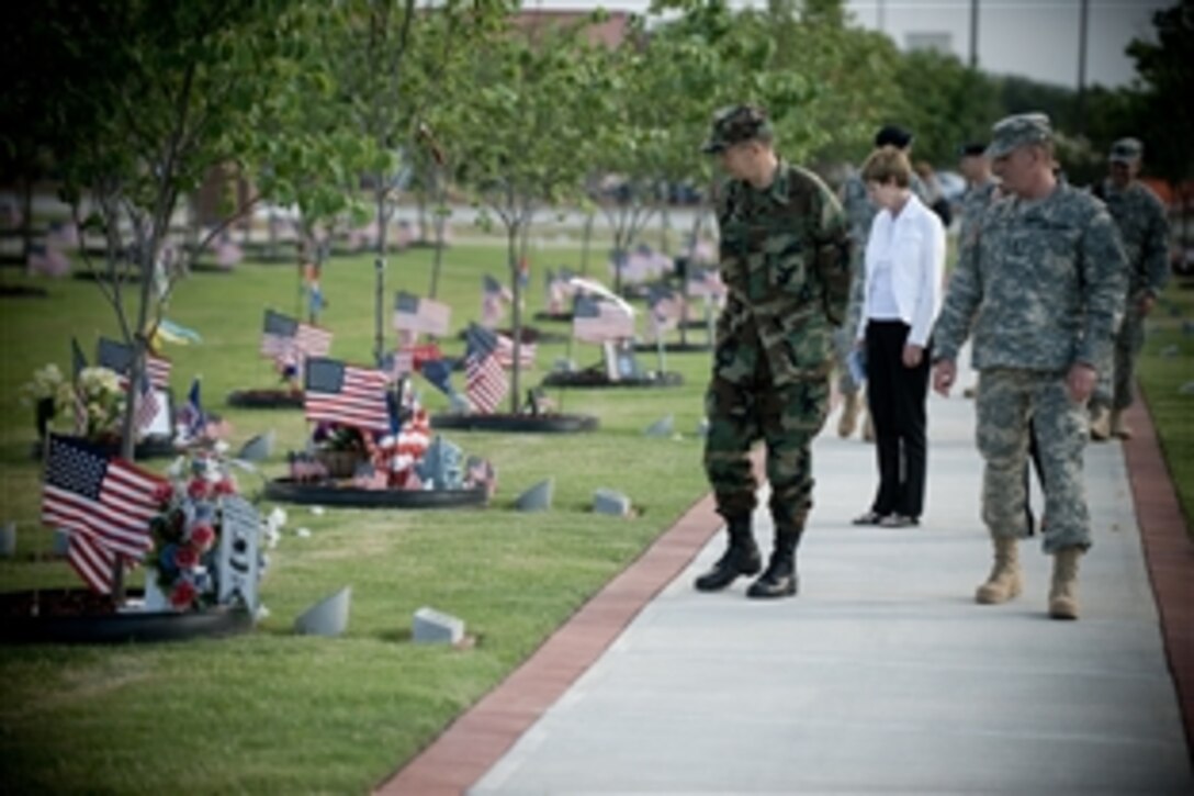 U.S. Navy  Adm. Mike Mullen, chairman of the Joint Chiefs of Staff, Deborah Mullen and Lt. Gen. Rick Lynch, commanding general, 3rd Infantry Division, visit Warriors Walk, a garden on Fort Stewart, Ga., June 11, 2008. The garden is in memory of 3rd ID soldiers killed in operations Iraqi Freedom and Enduring Freedom. 