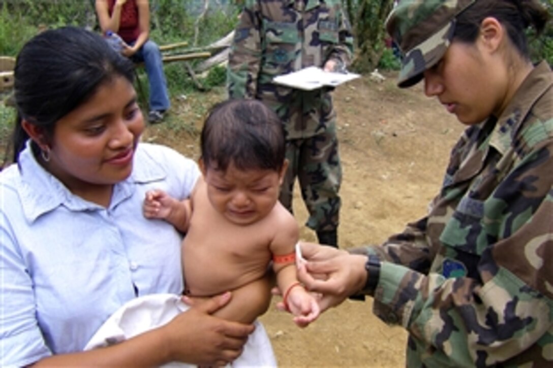 U.S. Air Force Capt. (Dr.) Larrisa Newman measures the mid-upper arm circumference of a child in Honduras, June 3, 2008, to evaluate for malnutrition. Newman is a pediatric resident from Wilford Hall Medical Center in San Antonio, Texas.